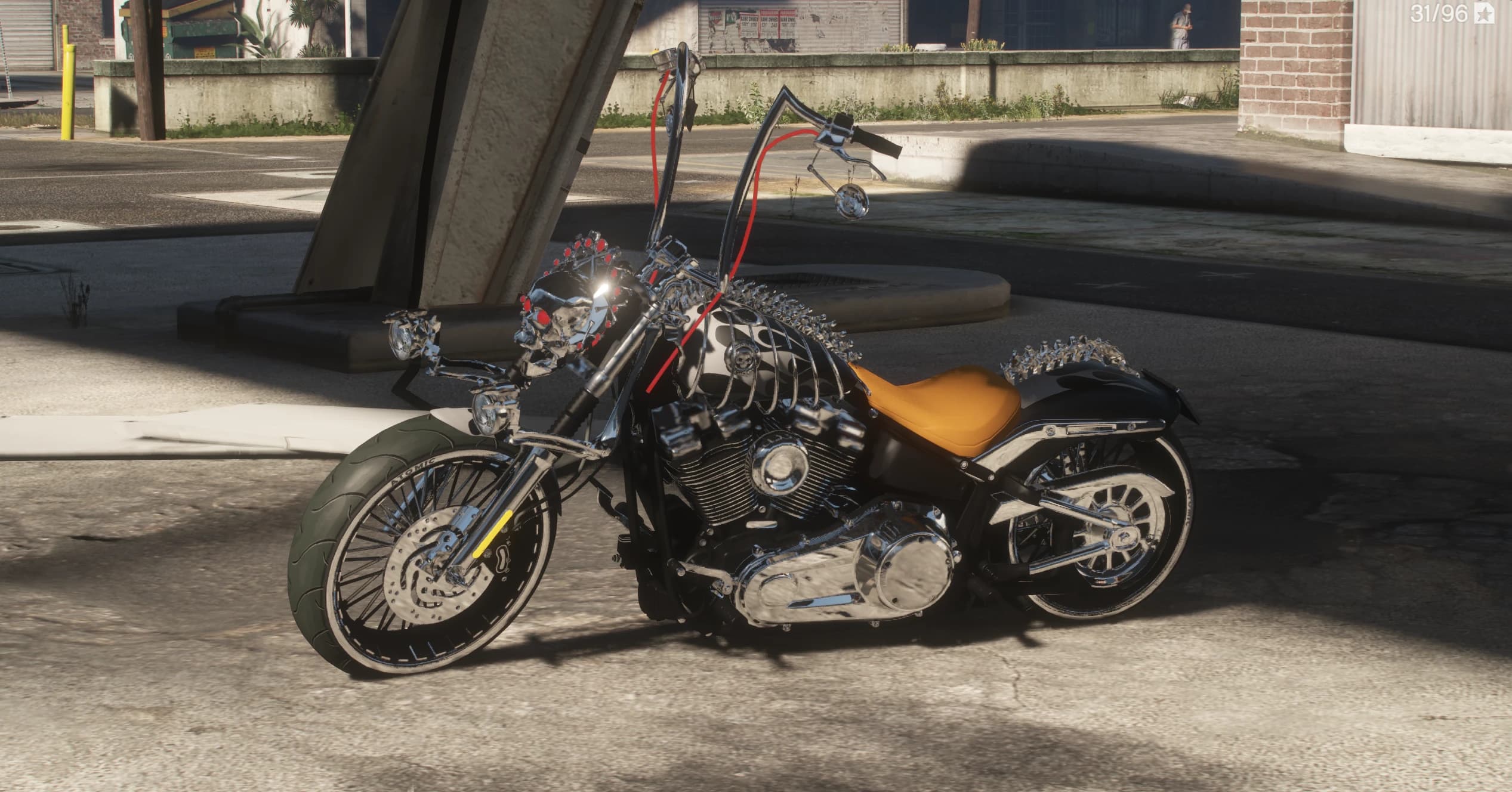 Side view of the black custom chopper with tall ape hanger bars, glowing red cables, a chrome skull over the headlight, spiked spine detail and an amber solo seat