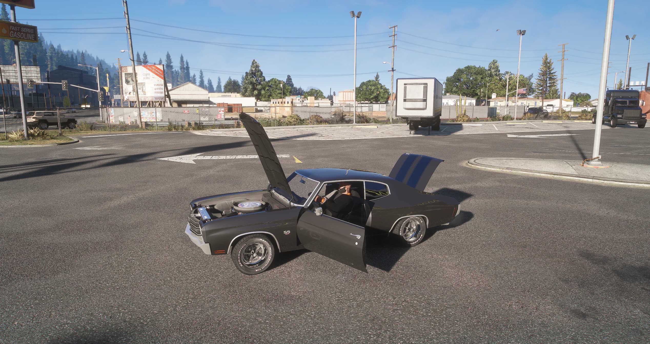 The Chevelle at a crossroads with the bonnet, the driver's door and the boot open, showing the engine with its chrome air cleaner, the driver sitting inside and the blue stripes on the boot lid