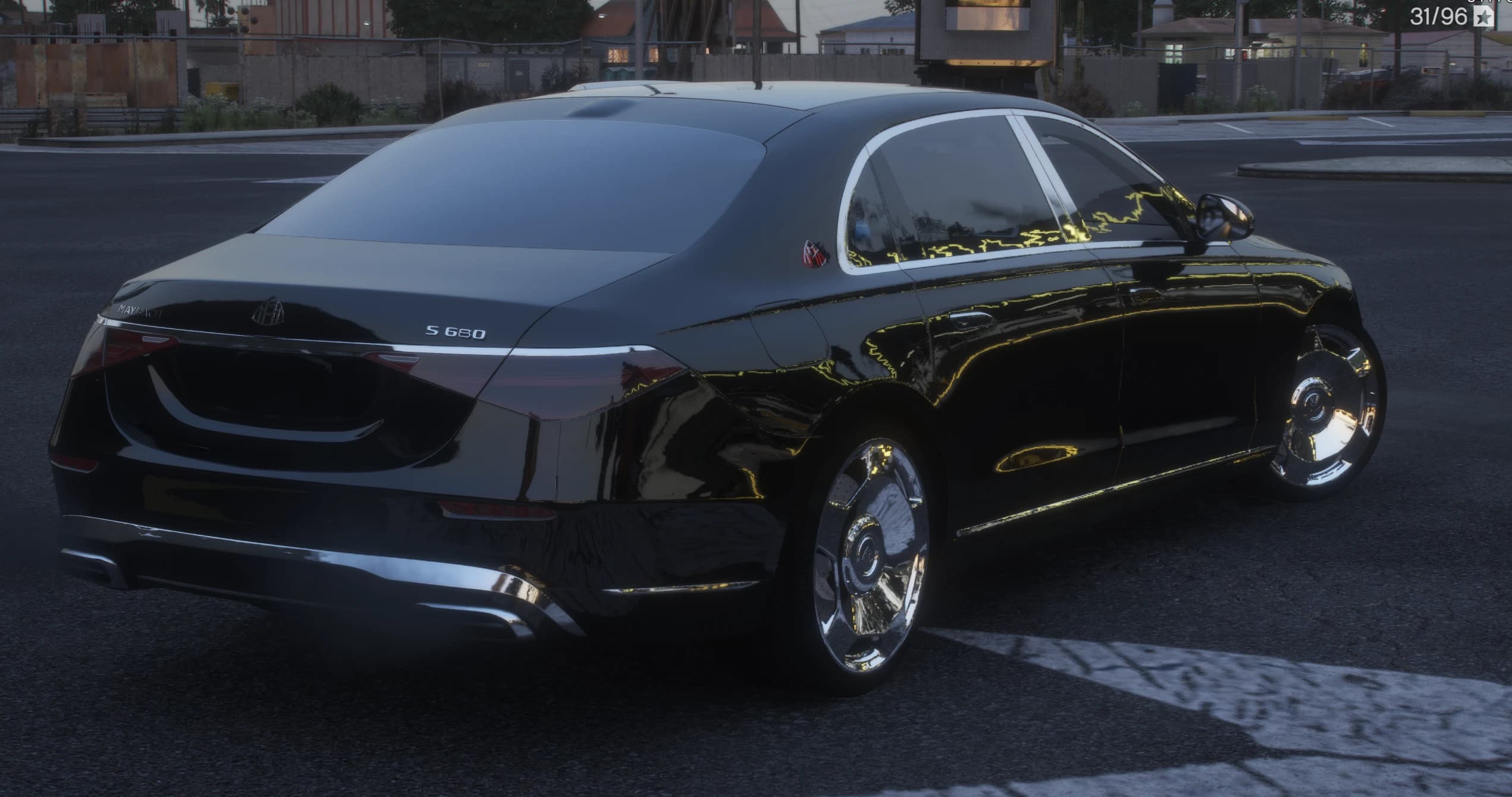 Rear three quarter with the MAYBACH lettering across the boot, the S 680 badge, chrome bumper trim and the chrome dish wheels