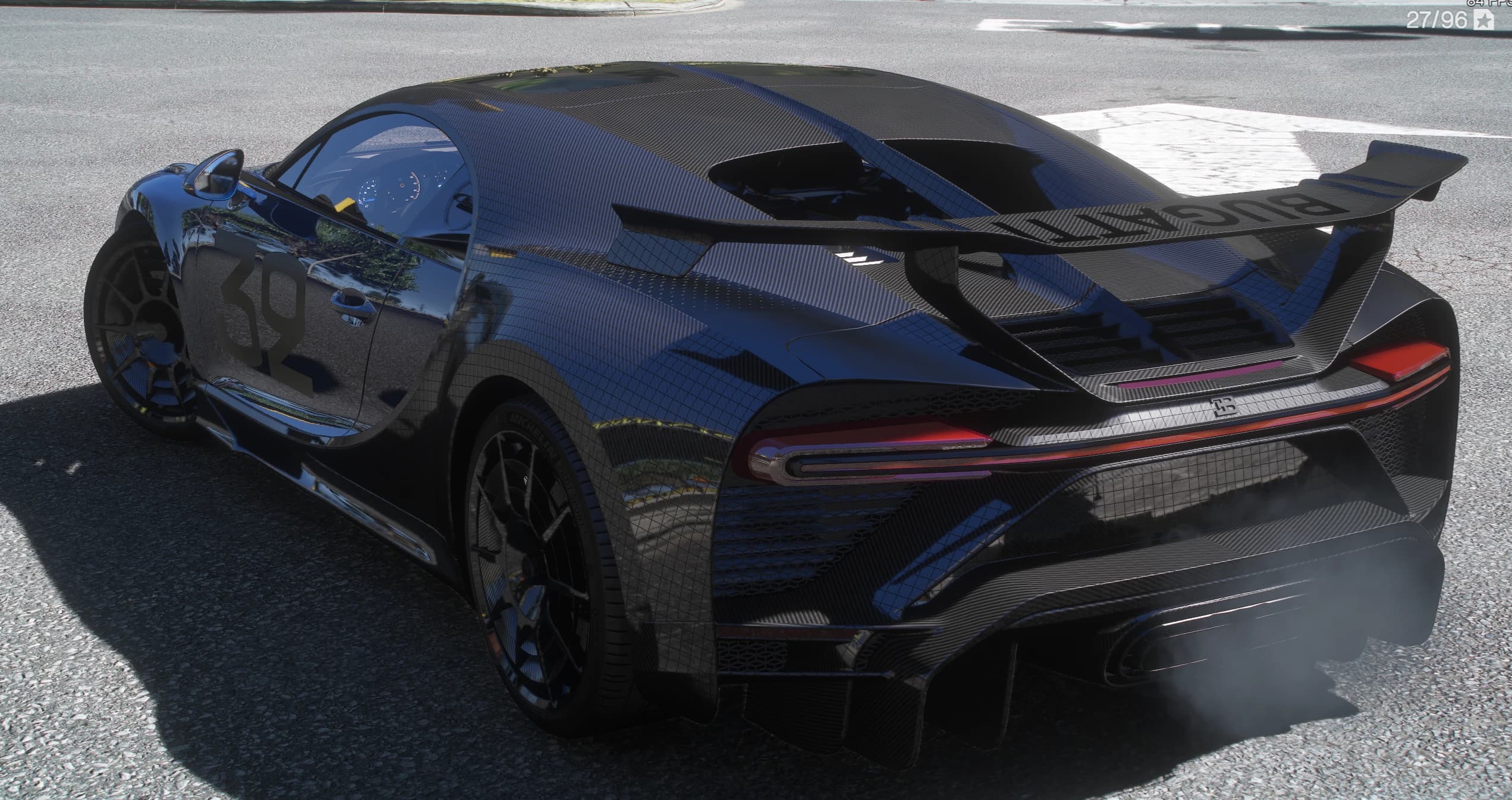 Rear three-quarter of the Chiron with the full-width red tail light lit, the BUGATTI lettering under the big rear wing, the exposed carbon rear deck and exhaust smoke drifting off the diffuser