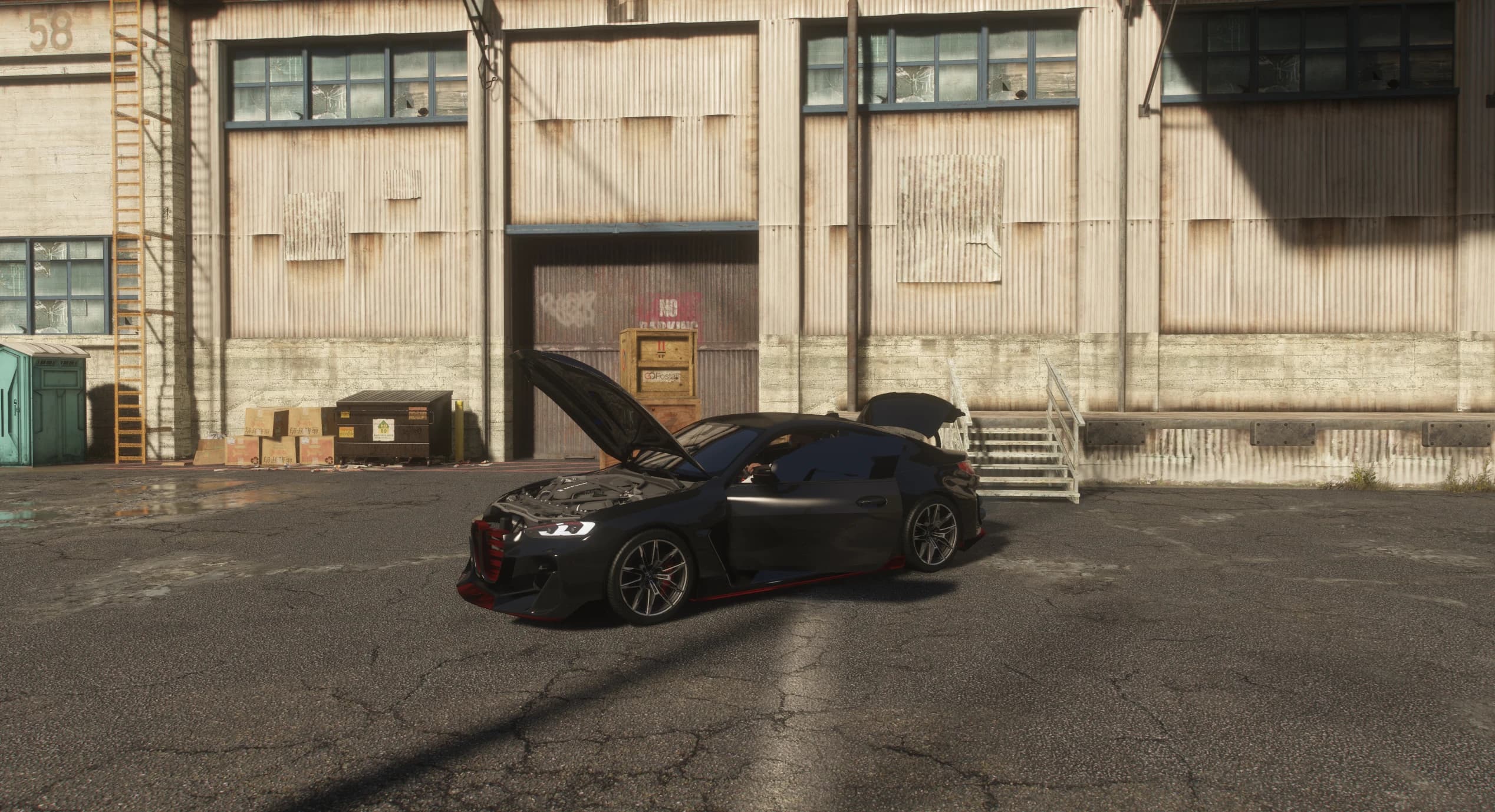 Wide shot with the bonnet and boot open showing the modelled engine bay in front of a corrugated warehouse