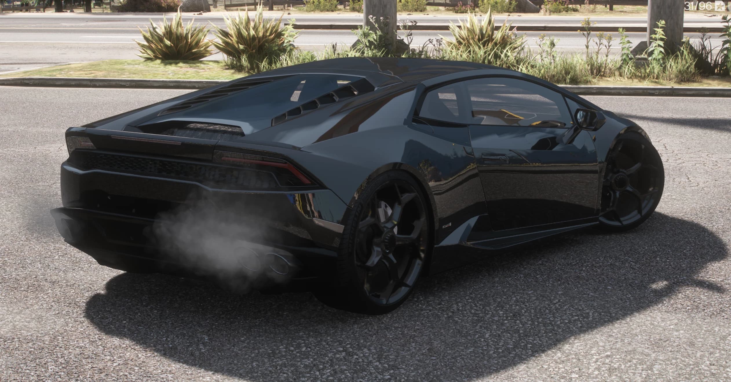 Rear three quarter view of the black Huracan with the louvred engine cover and smoke drifting from the four round exhaust tips