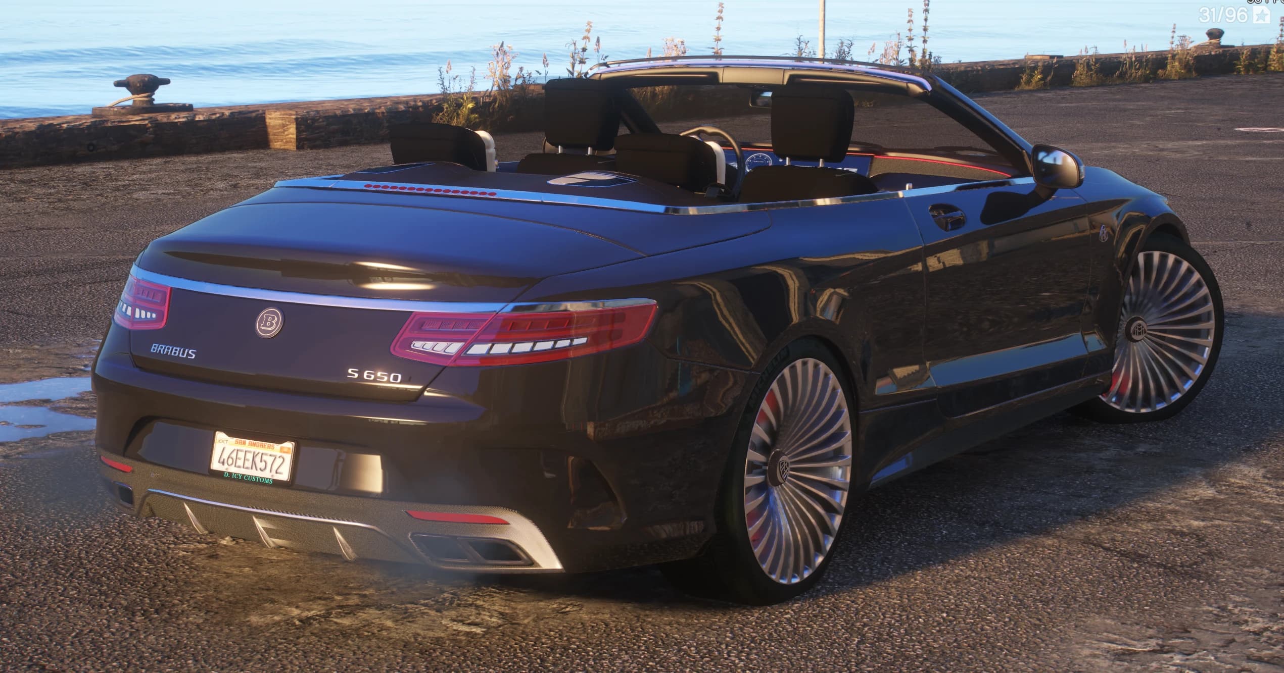 Rear three quarter view at a seaside dock with the top down, showing the Brabus and S650 badges, quad exhaust tips and a San Andreas plate with a D. Icy Customs frame