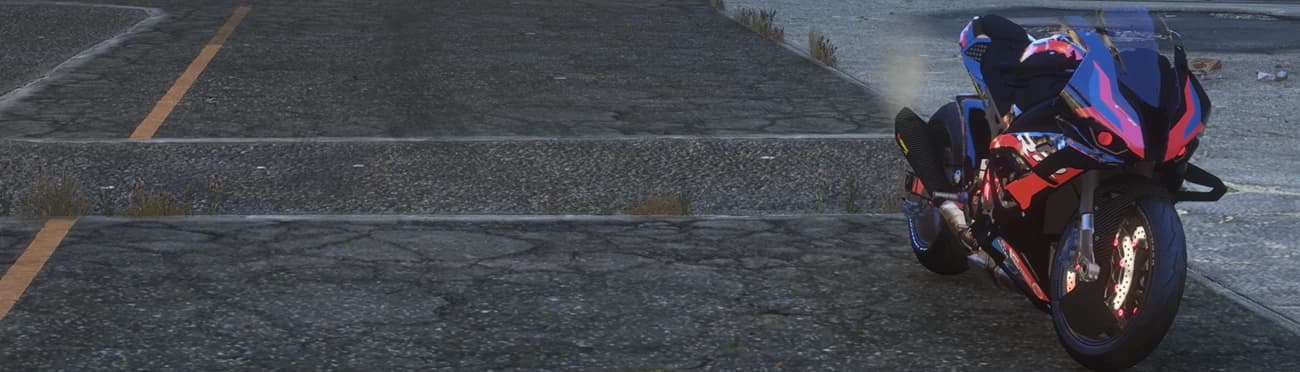 Wide shot of the stretched M1000RR parked on a cracked and littered lot at dusk