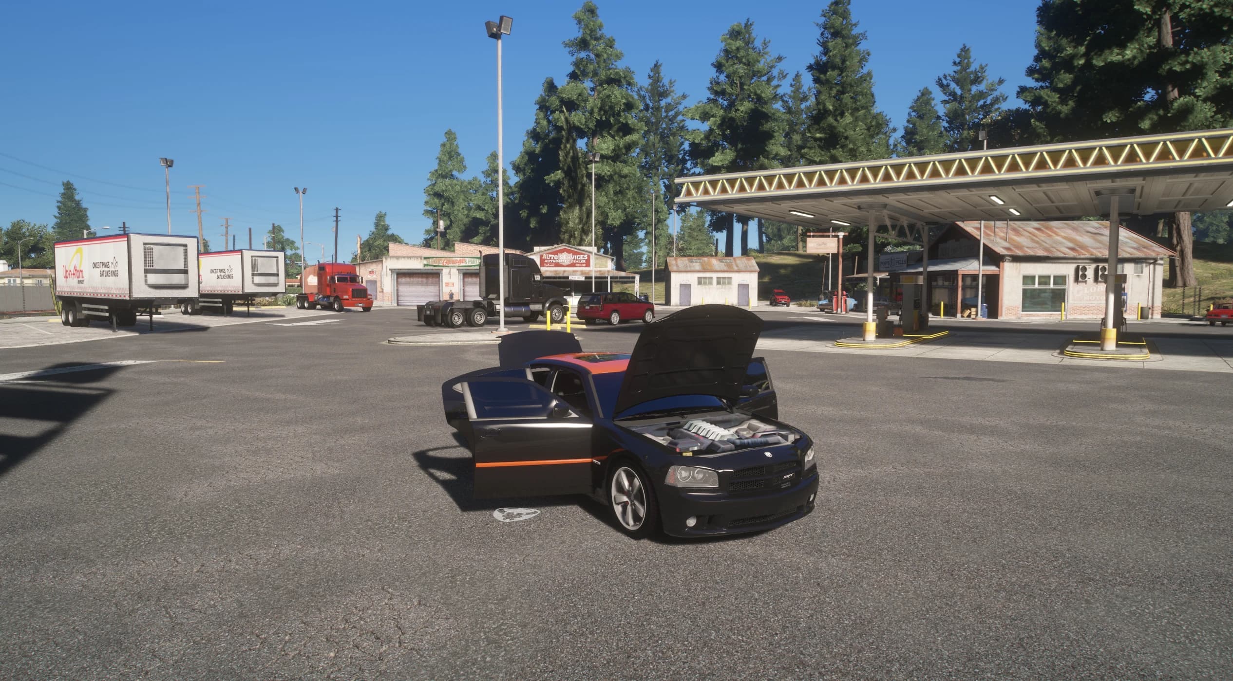 Wide shot at a rural gas station and garage with the Charger's hood and doors open over the HEMI engine bay, surrounded by parked trucks and trailers