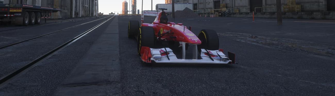 Front view of the Formula A car with its white front wing and helmeted driver on a dockside street