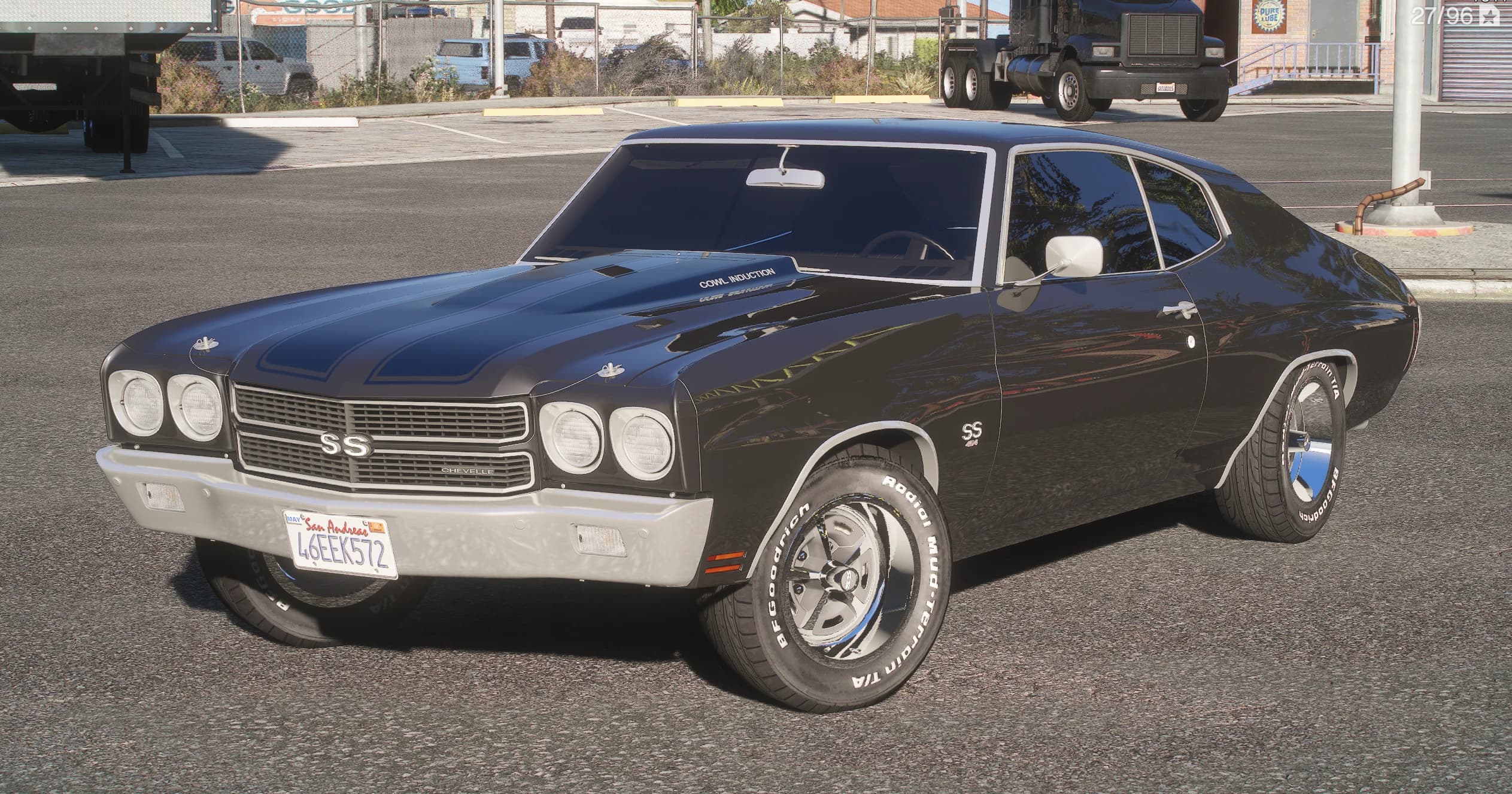 Black 1970 Chevrolet Chevelle SS in front three-quarter view, with the Cowl Induction bonnet and its blue stripes, quad round headlights, SS grille badge, chrome bumper and white-lettered BFGoodrich tyres on rally wheels