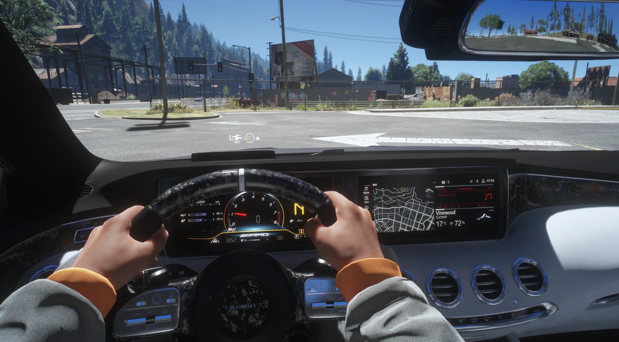 First person view of the forged carbon Mansory steering wheel with its white centre stripe, the AMG digital cluster with boost gauge and the wide dashboard screen showing the map
