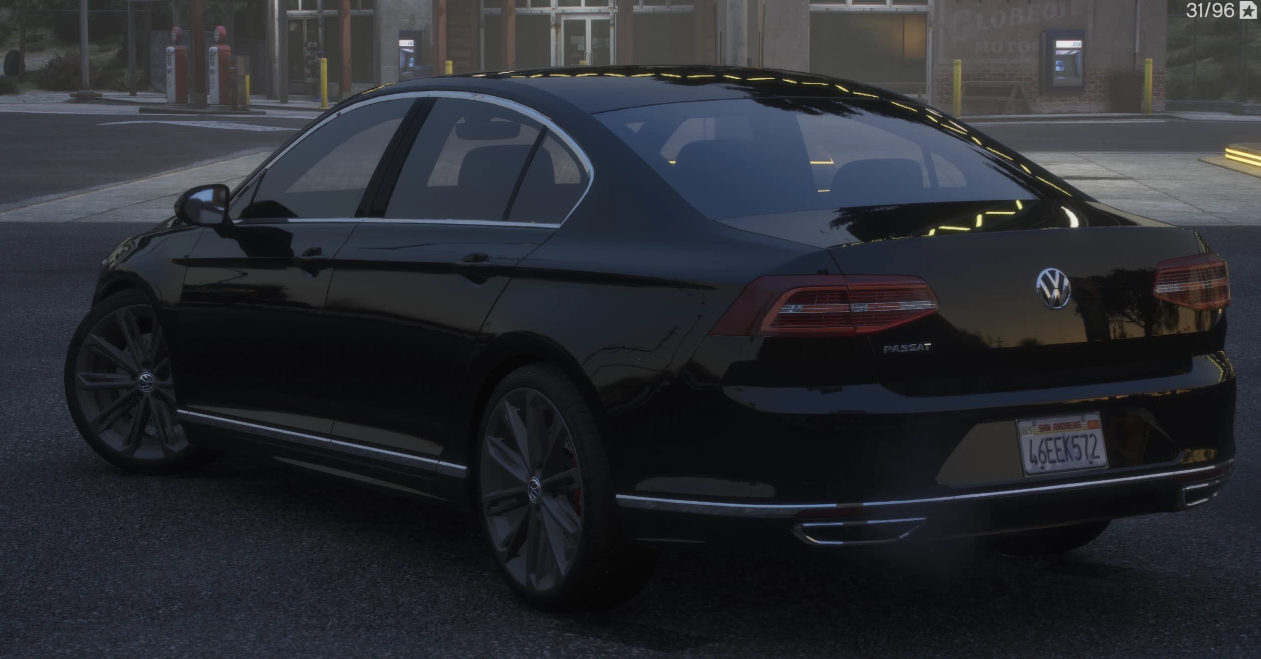 Rear three quarter view at an old gas station with the PASSAT lettering, red taillights and twin chrome exhaust tips