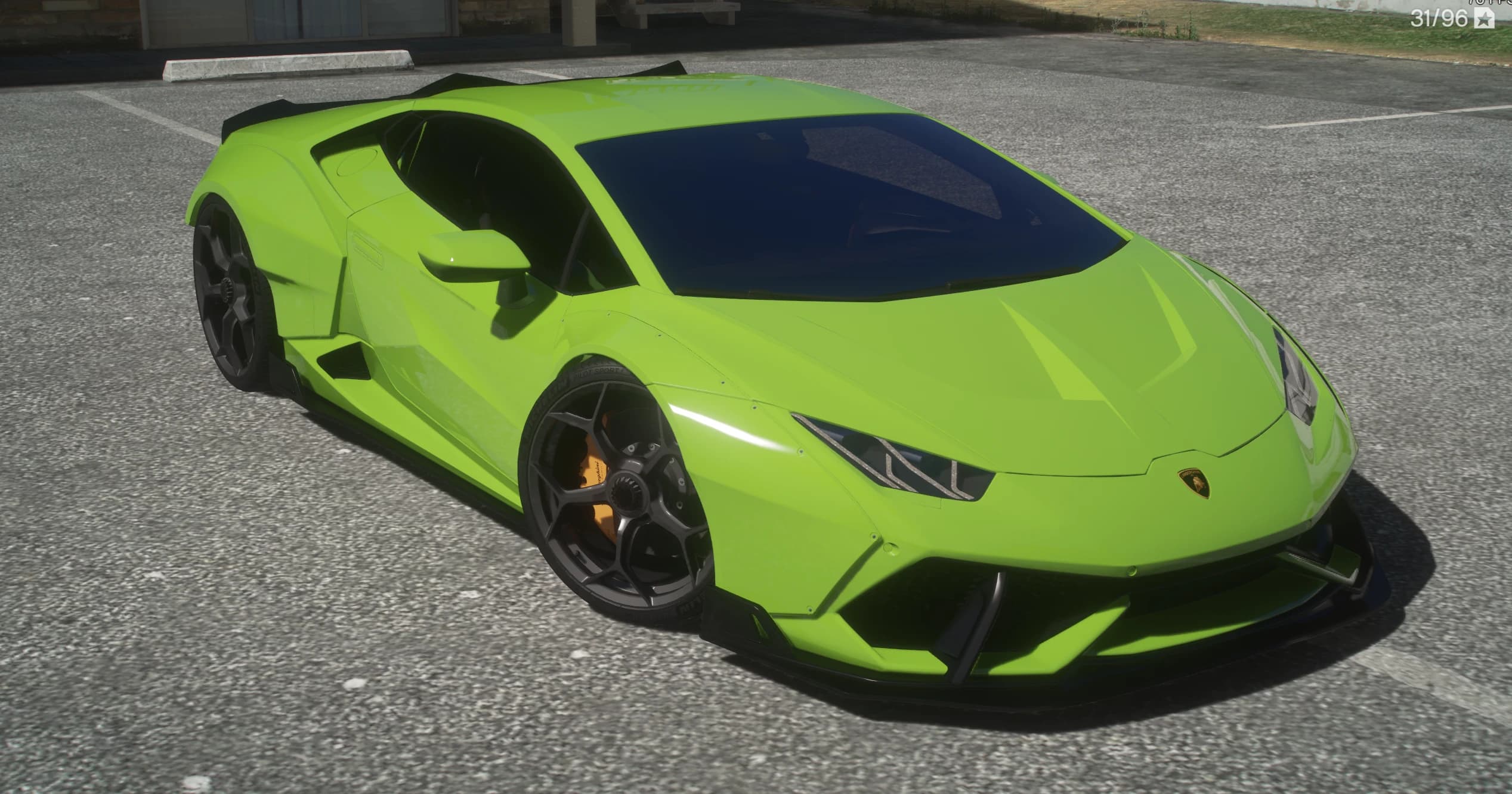Front three quarter view of the lime green widetrack Huracan with black canards, splitter, riveted arch extensions and orange brake calipers