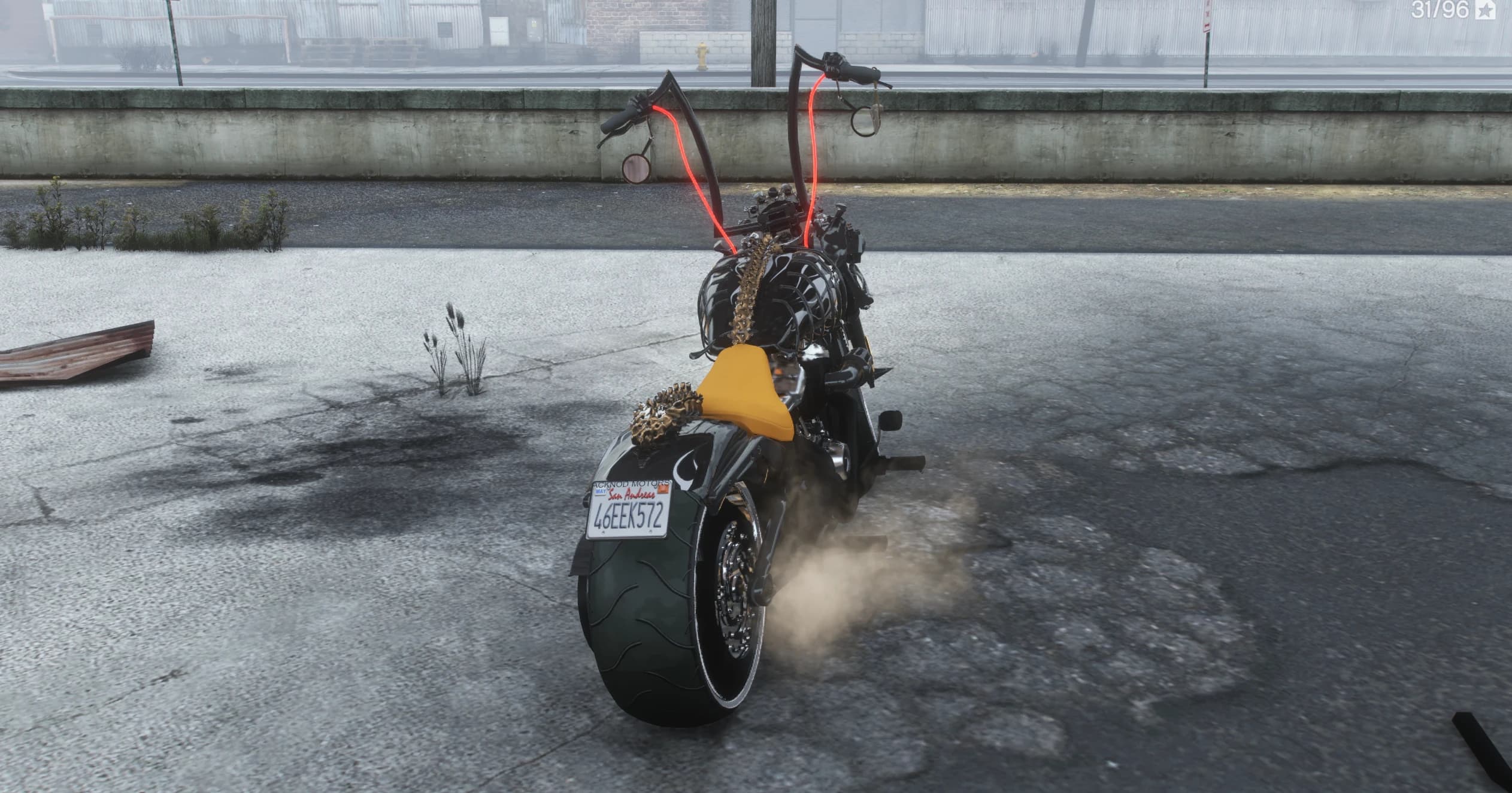 Rear view showing the fat rear tyre, the San Andreas plate on the fender and the chrome vertebrae running down onto the tail