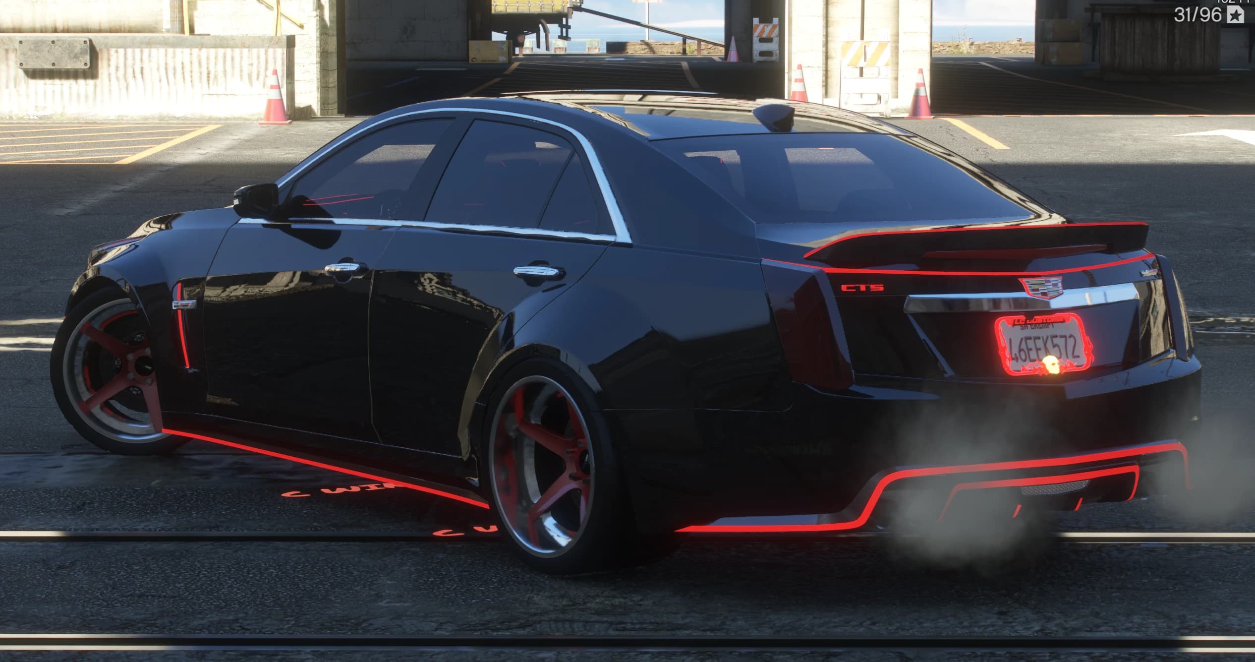 Rear three quarter view with the CTS badge, boot spoiler and diffuser outlined in glowing red while smoke rolls off the exhausts