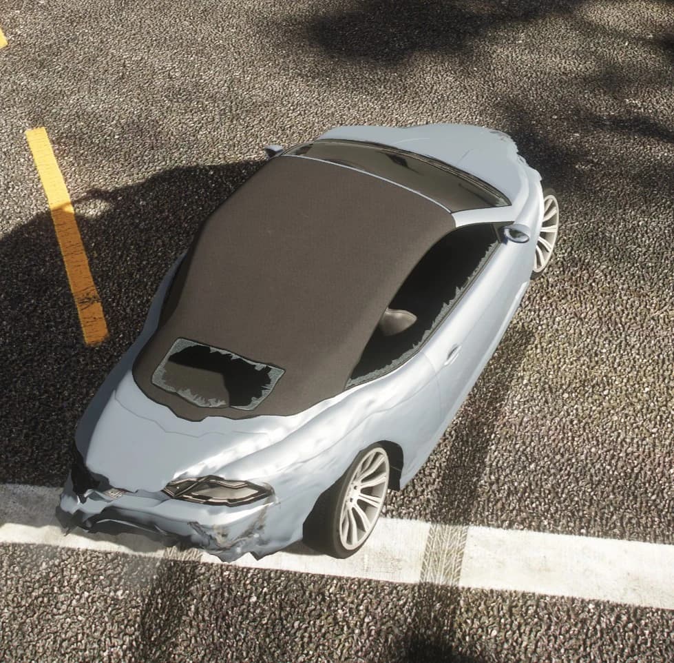 Top-down view of a grey coupe after hitting a kerb: the bonnet is peeled open and the front bumper is crushed