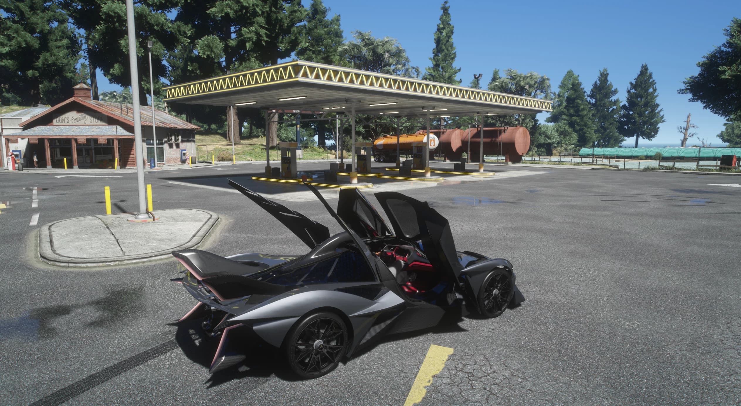The Apollo with both doors swung up and the wing folded flat at a country store gas station, showing the red and black cockpit