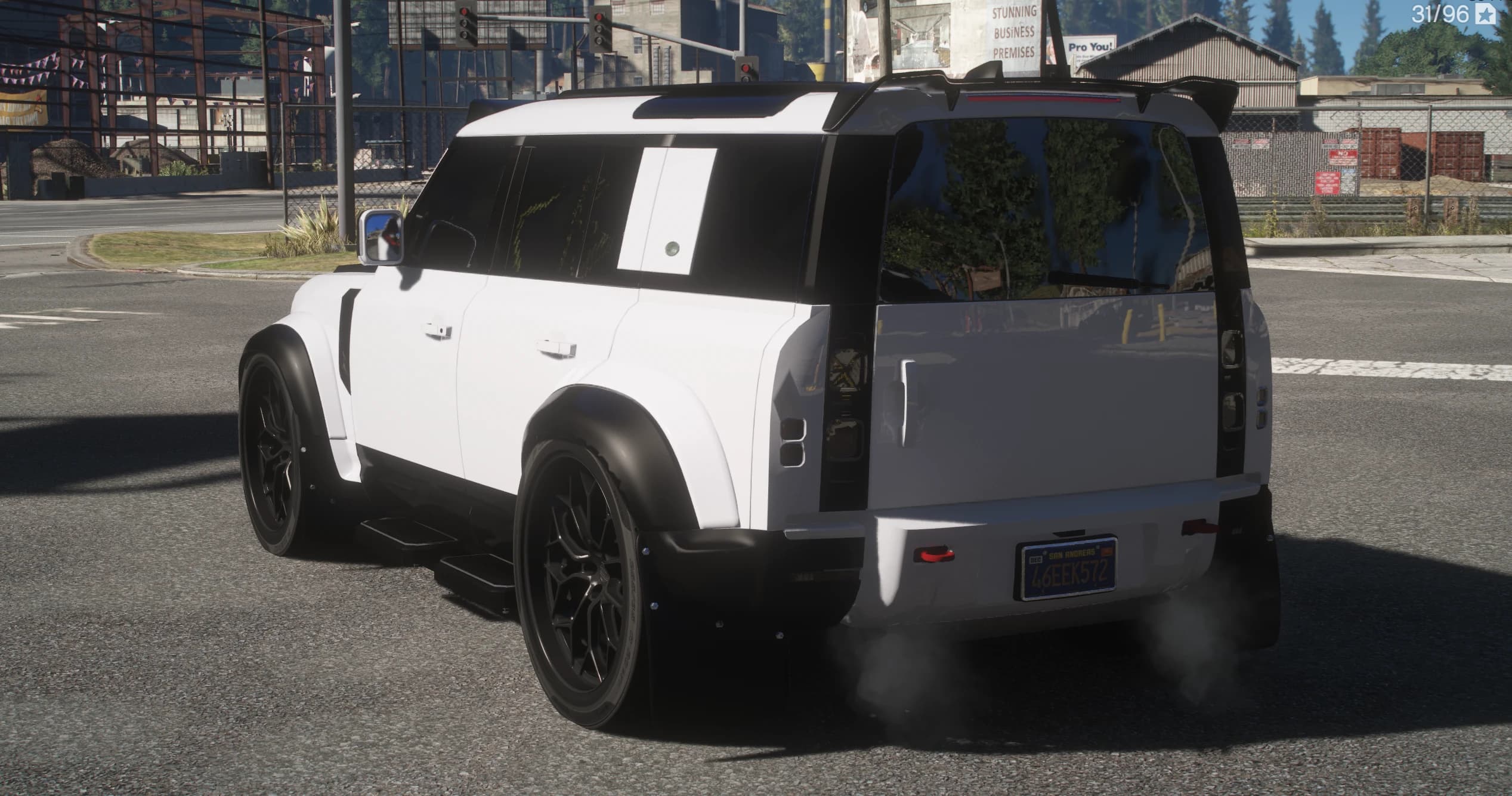 Rear three quarter view showing the roof spoiler, smoked taillights, mud flaps and the San Andreas plate on the tailgate