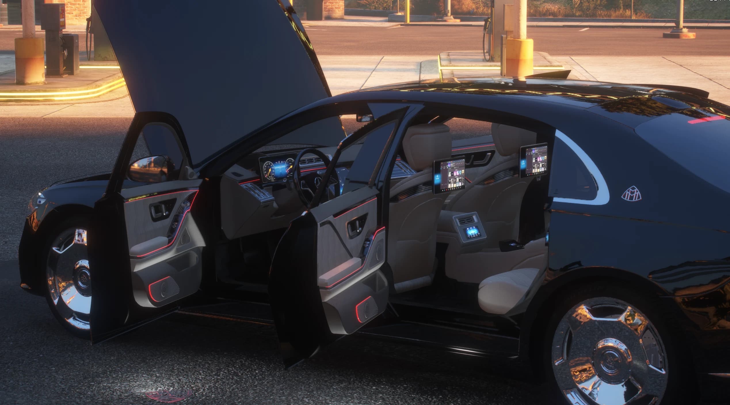 Hood and doors open at a gas station showing the cream leather cabin, the entertainment screens on both front seatbacks, the rear climate console and the red ambient light lines