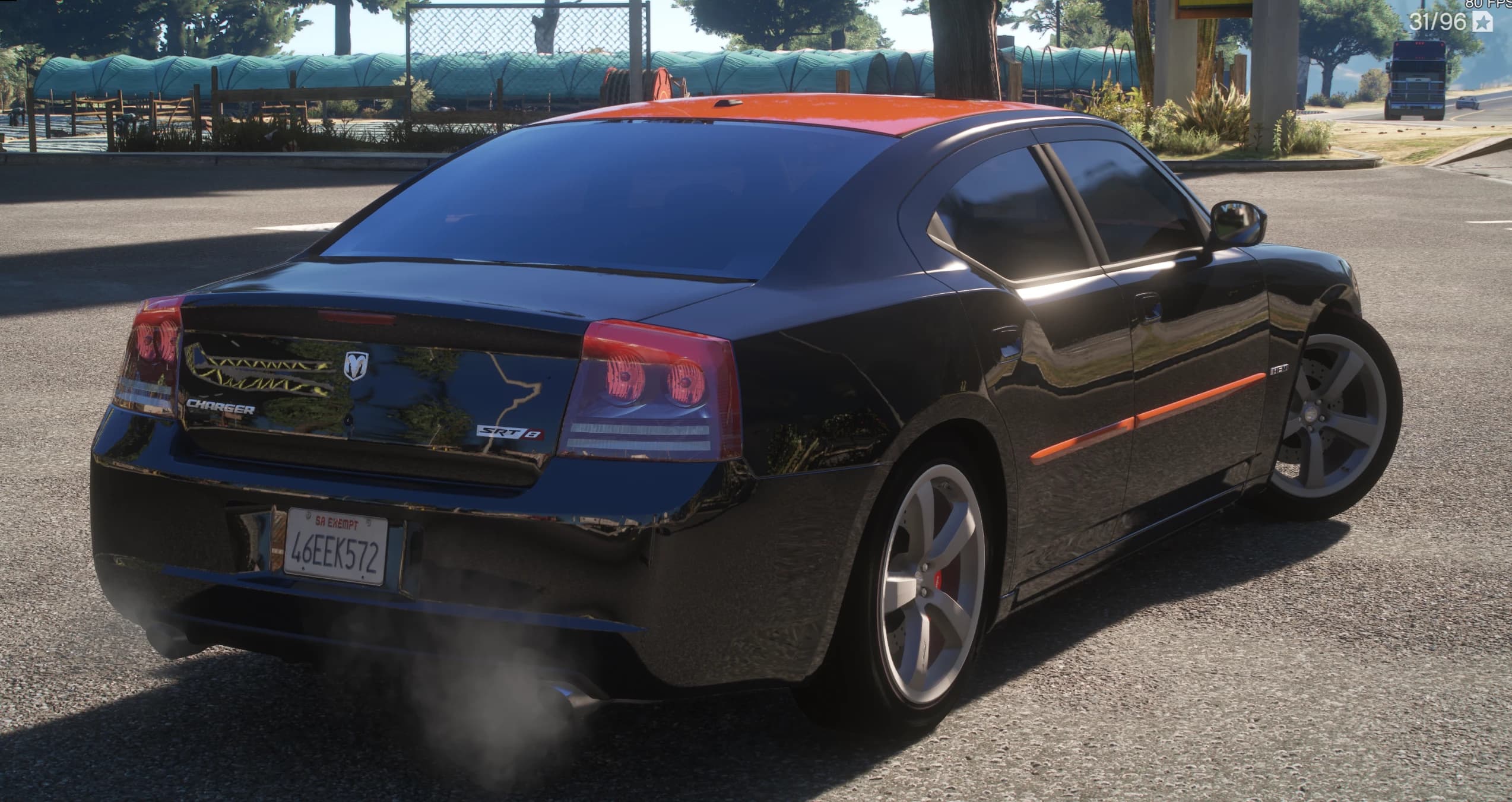 Rear three quarter view with the Charger and SRT8 badges on the trunk lid, the orange roof and side stripe, and exhaust smoke next to a roadside farm