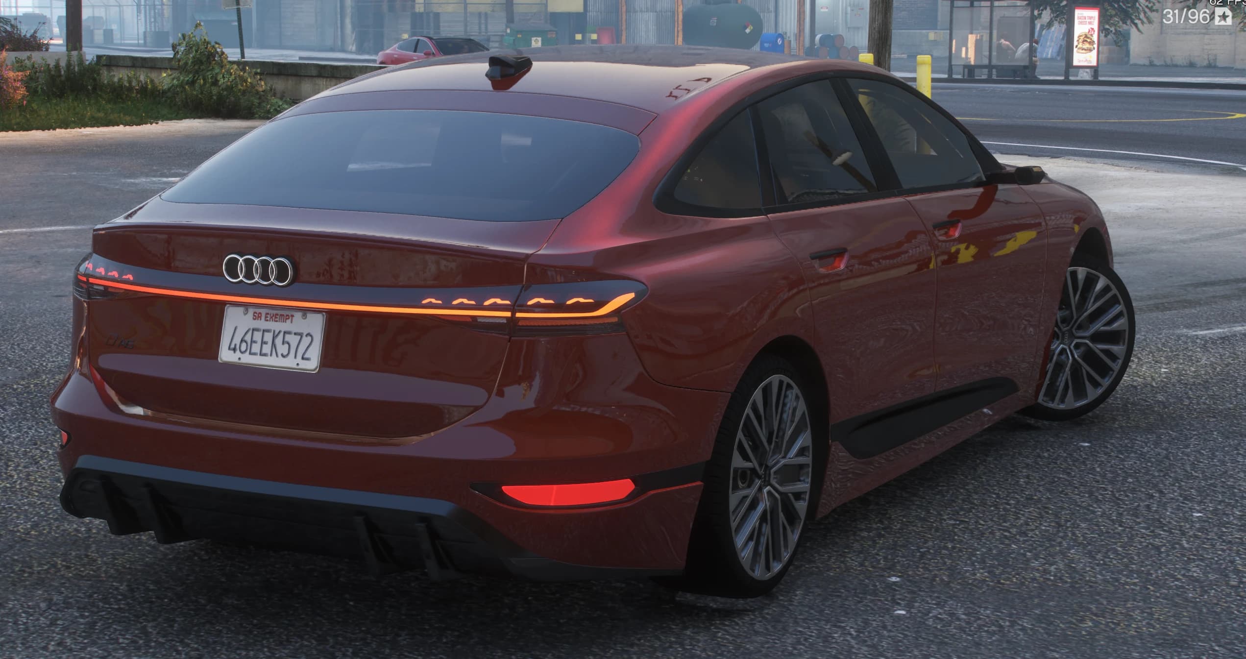 Rear three quarter view showing the full width taillight bar with lit rings, segmented indicators and a San Andreas plate