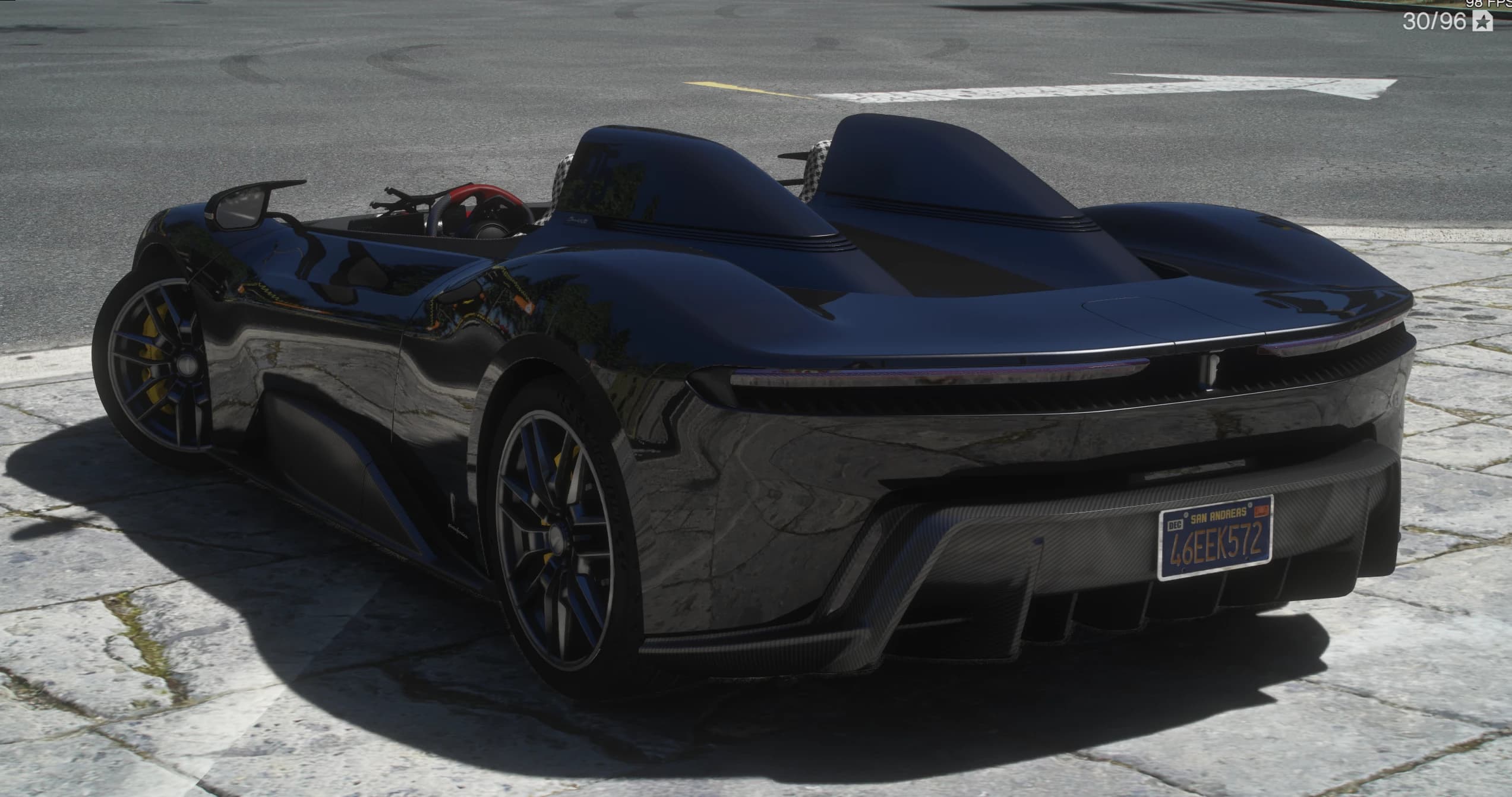Rear three quarter view showing the full width rear light bar, the huge carbon diffuser, yellow brake calipers and the San Andreas license plate