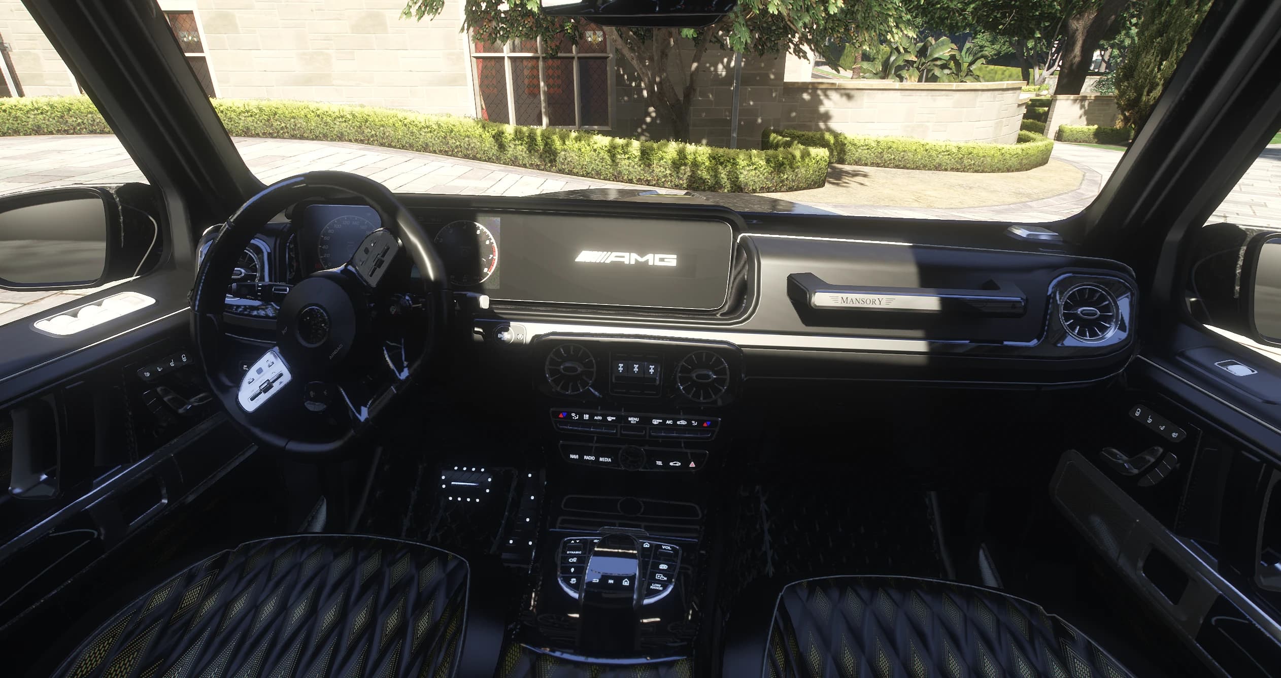 Interior of the Mansory G63 with the AMG digital cluster, Mansory badge on the dash and diamond quilted seats
