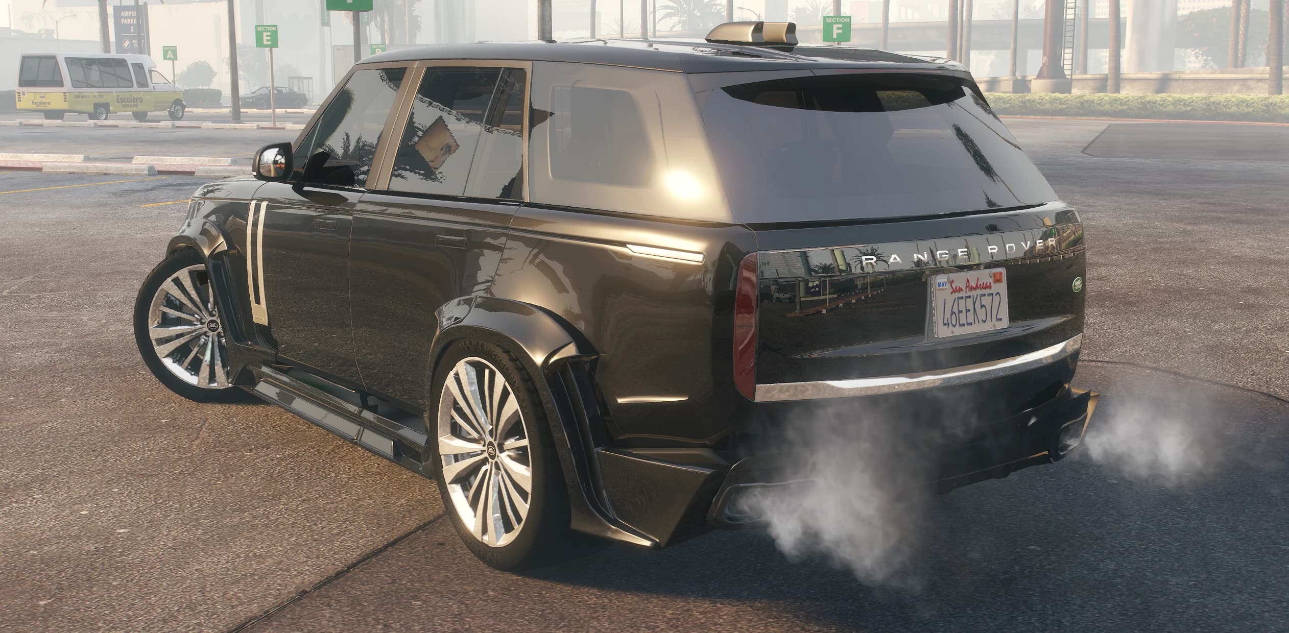 Rear view of the Range Rover Vogue with the Wald arches, diffuser and smoke from the exhausts