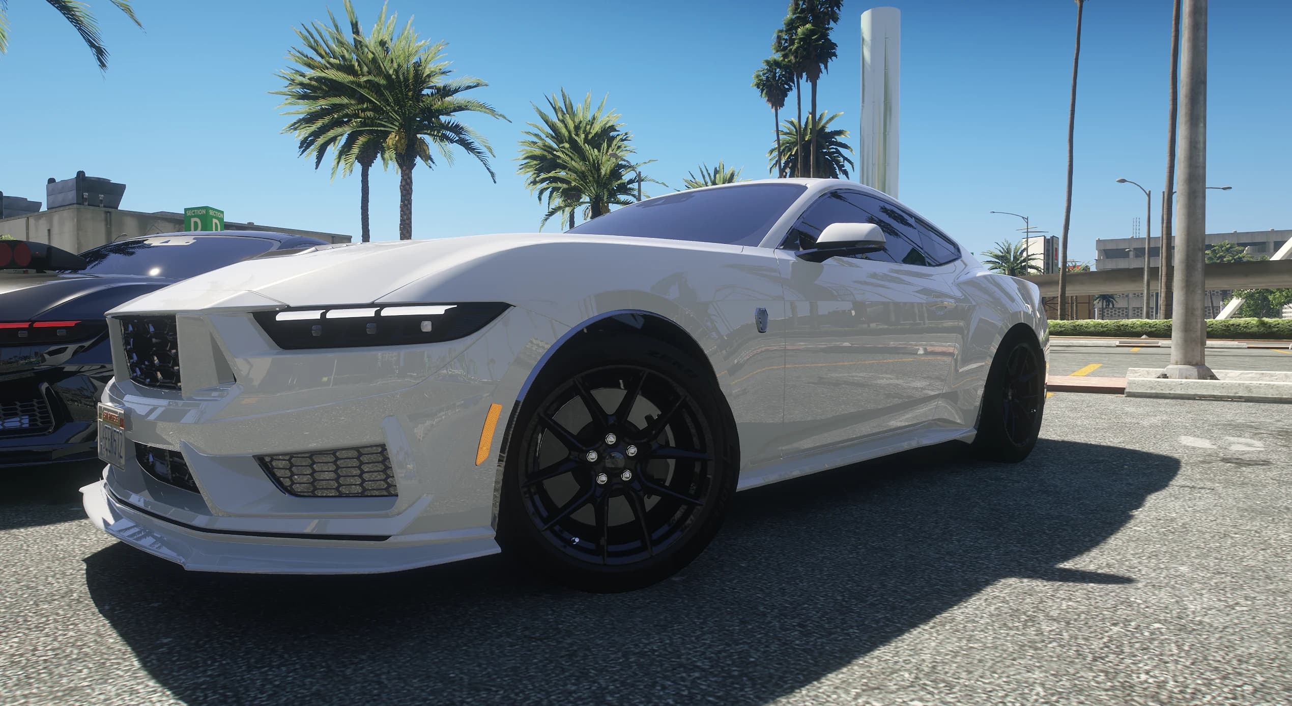 White stock 2025 Mustang with the tri bar LED headlights and black wheels