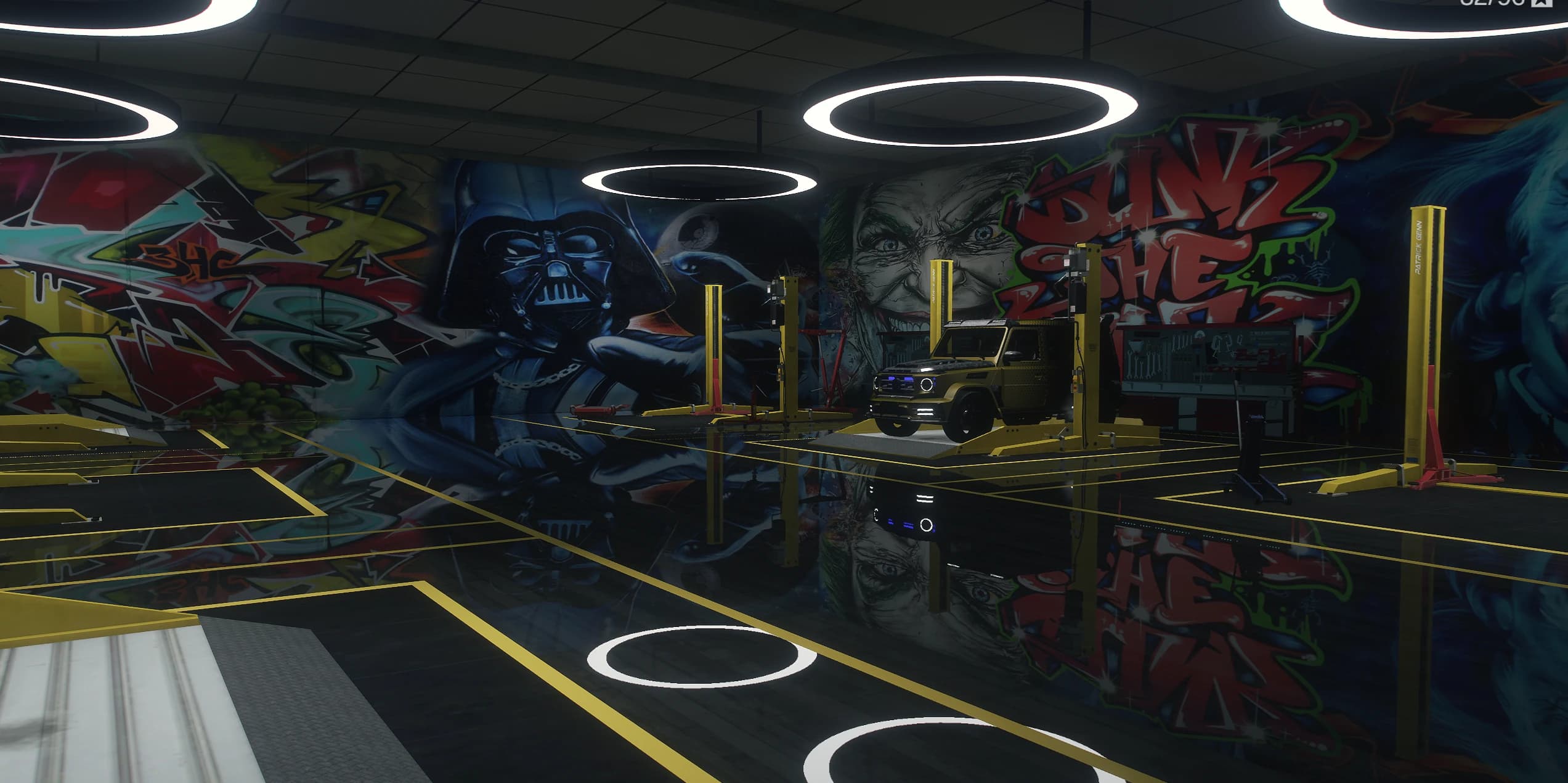Workshop interior with a gold SUV on a lift pad surrounded by floor to ceiling graffiti murals