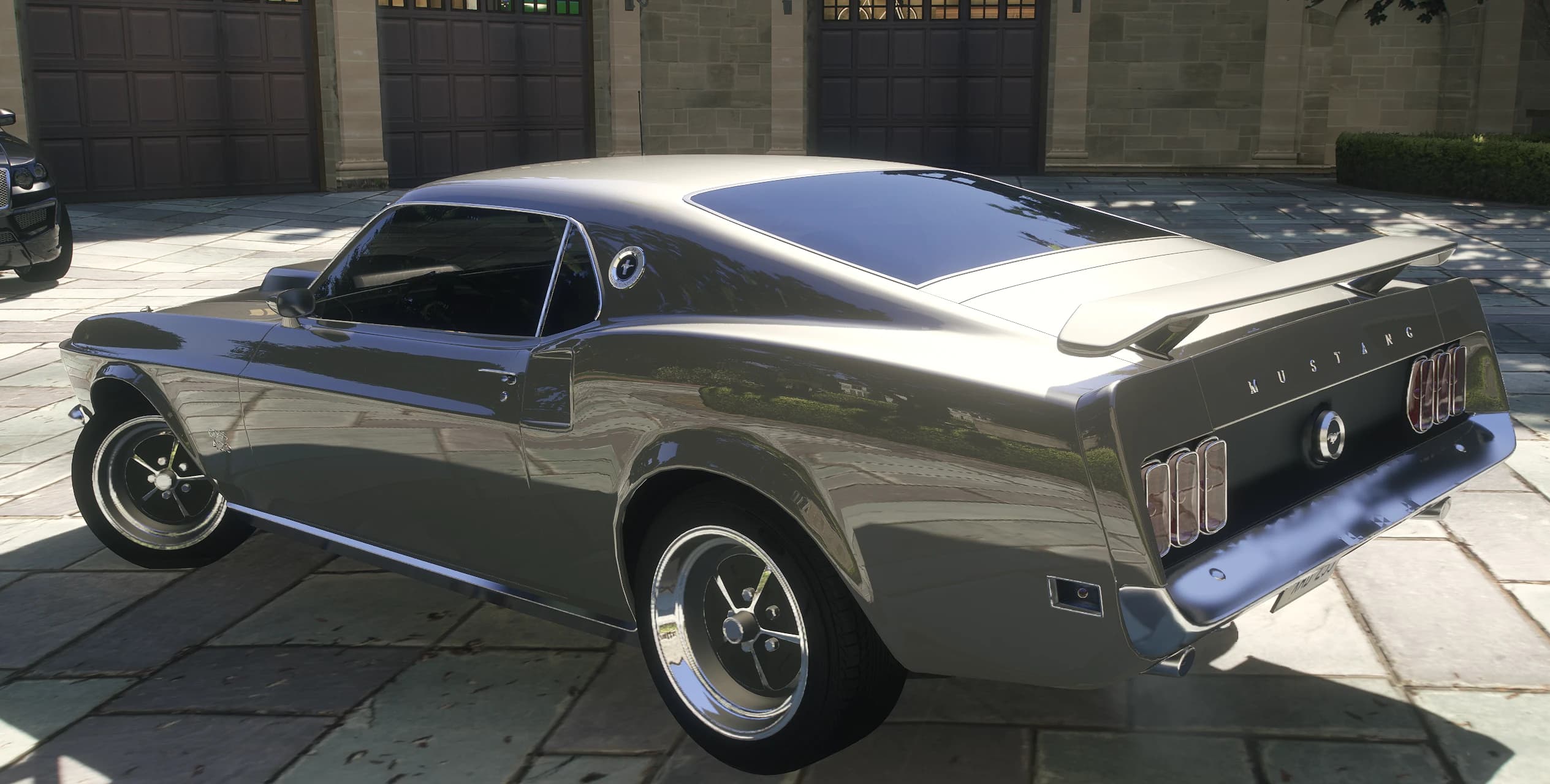 Rear view of the Mustang Boss 429 with the spoiler, chrome wheels and Mustang lettering on the tail panel