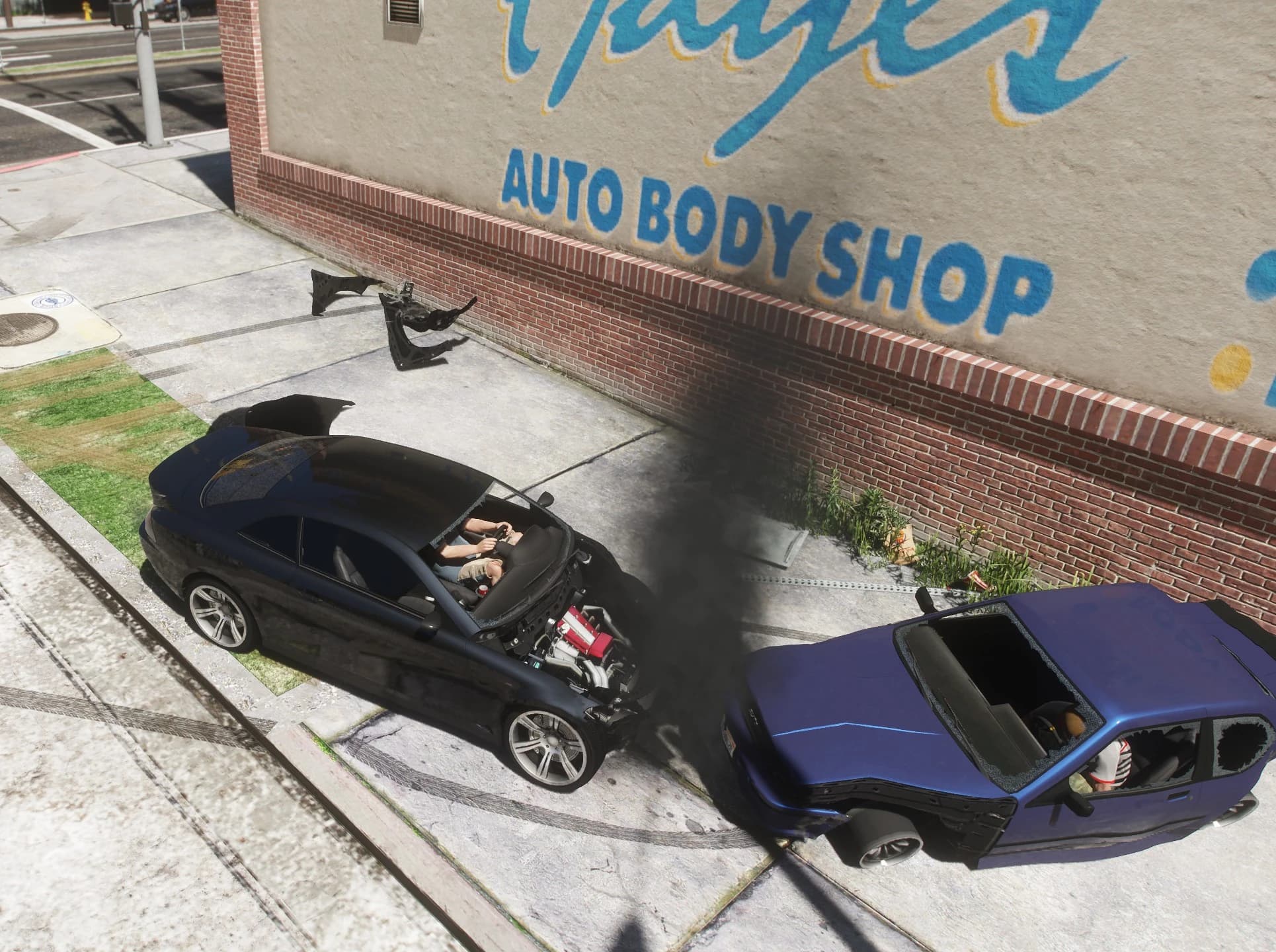 Head-on crash outside the Auto Body Shop: the black coupe's bonnet has been ripped away, leaving the engine block exposed and smoking