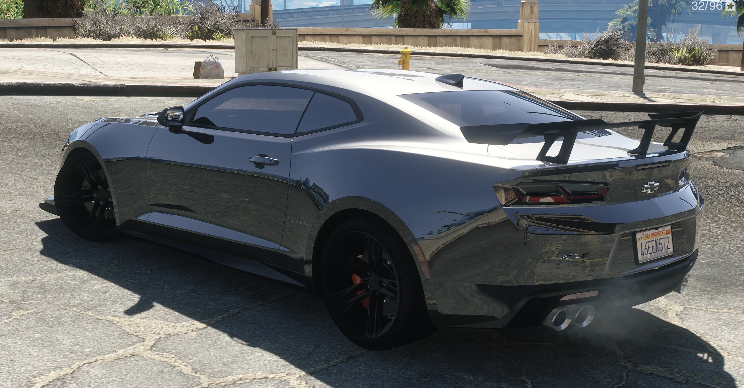 Rear three quarter view of the ZL1 with the tall black wing, darkened taillights and twin exhaust tips