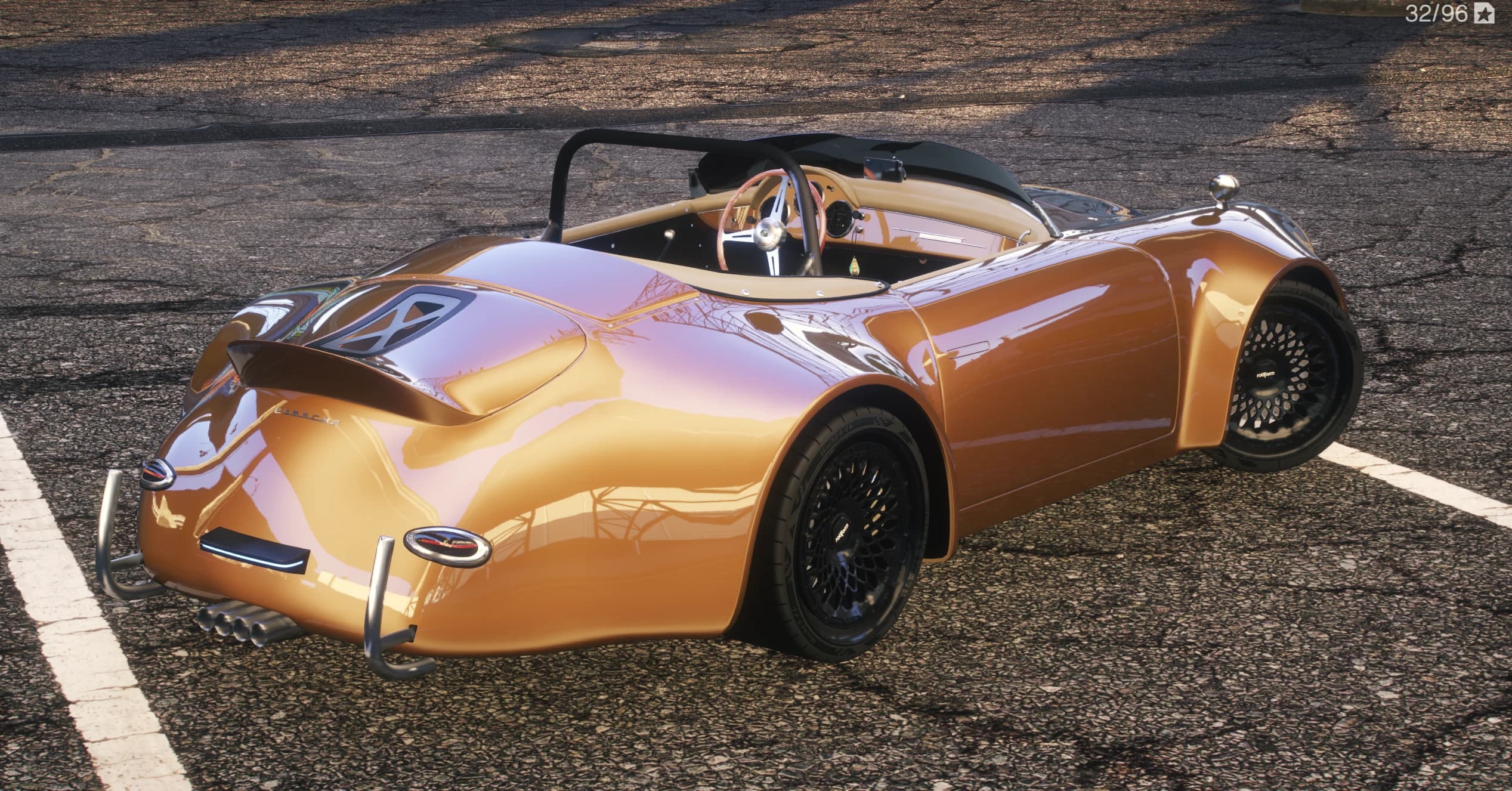 Rear three quarter view of the Speedster with the ducktail spoiler, quad center exhaust and black mesh wheels