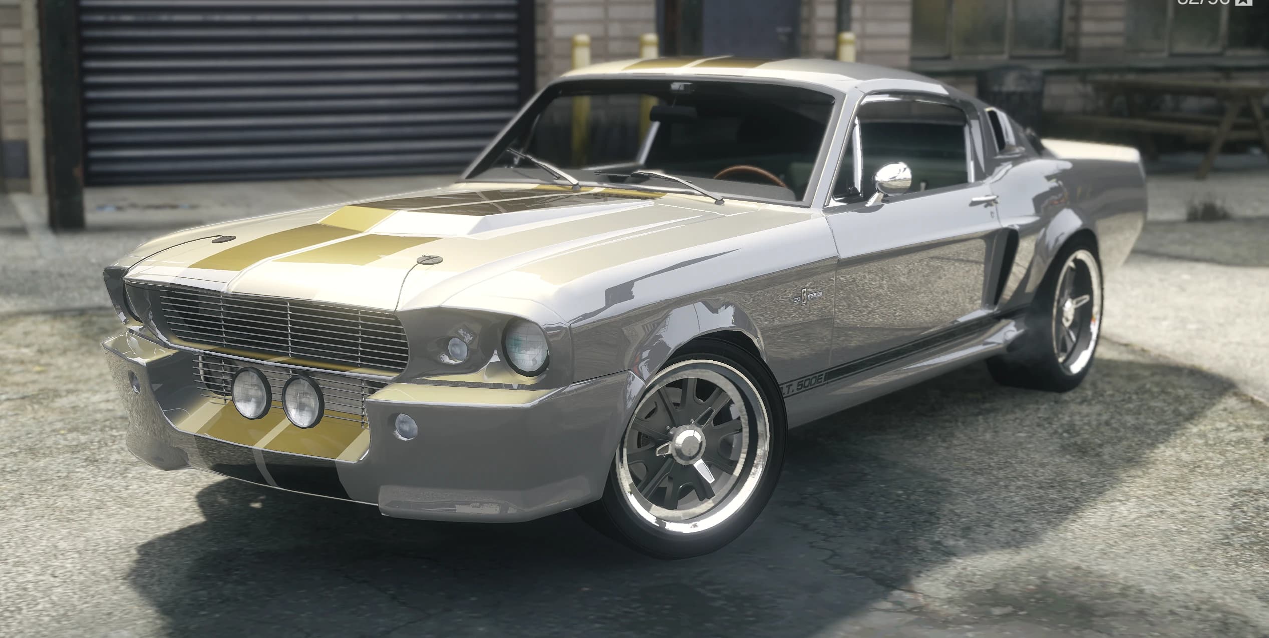 Front three quarter view of the silver Eleanor with gold stripes, driving lights and the GT500E side stripe