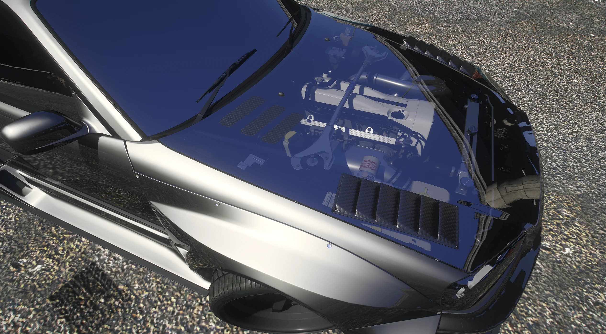 Overhead view of the R34's glass hood showing the modeled Nissan RB inline six engine underneath
