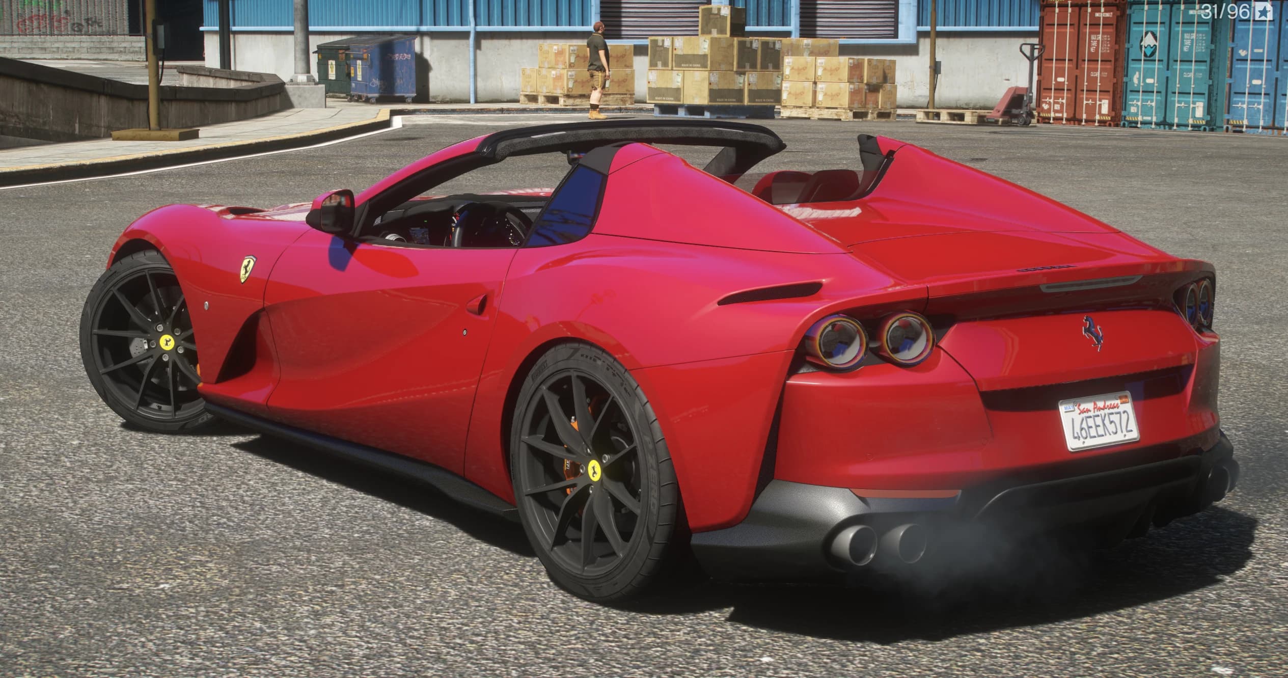 Rear three quarter view of the open top 812 GTS showing the twin round taillights, buttresses behind the seats and Pirelli tyres