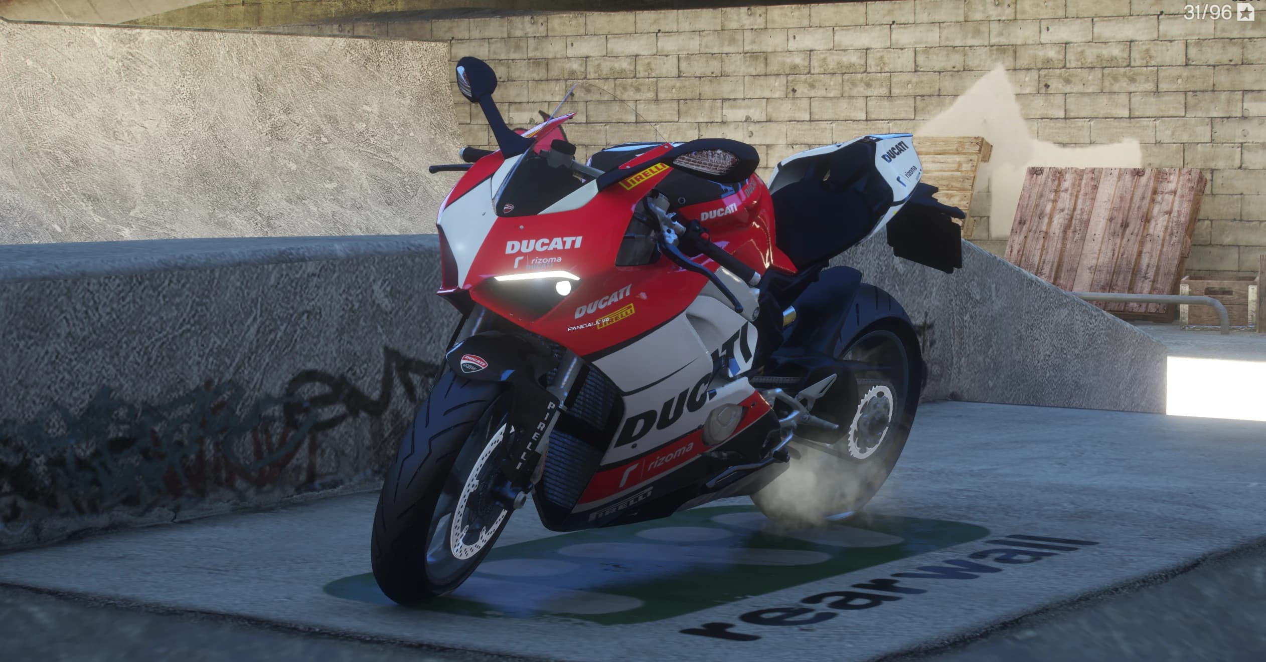 Left side view in a concrete skatepark with the LED daytime lights on and rizoma and Pirelli decals on the fairing