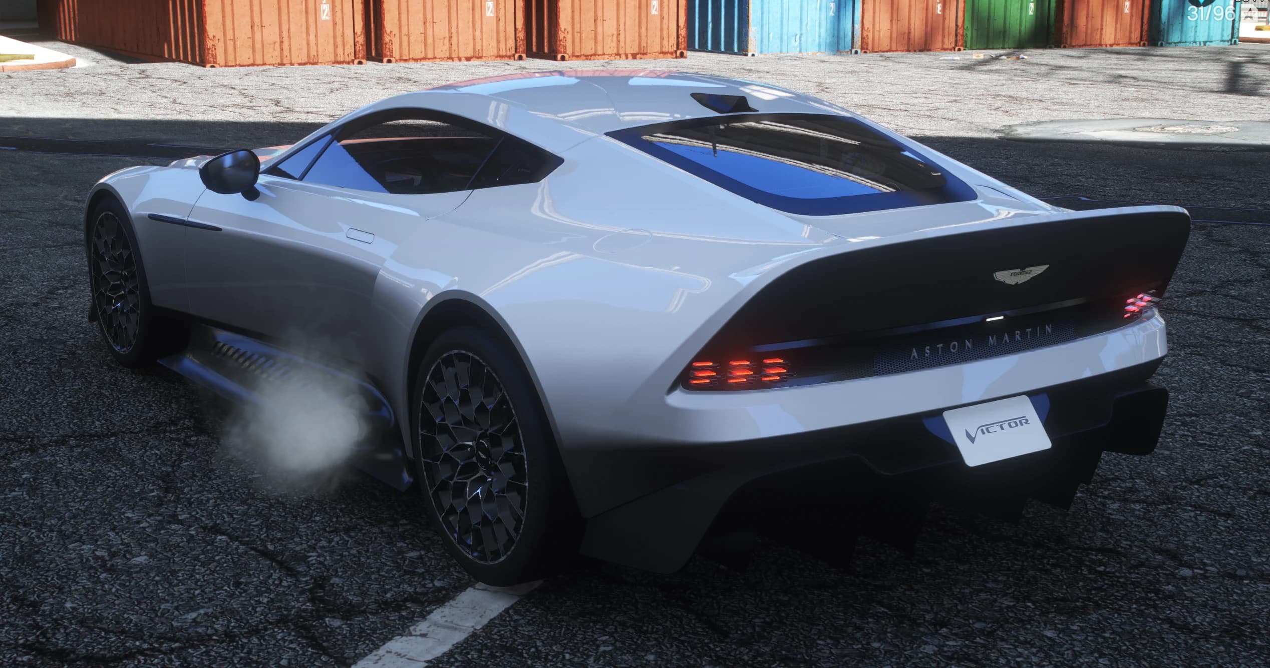 Rear three quarter view of the Victor with its carbon kamm tail, Aston Martin lettering over the light bar and a VICTOR plate