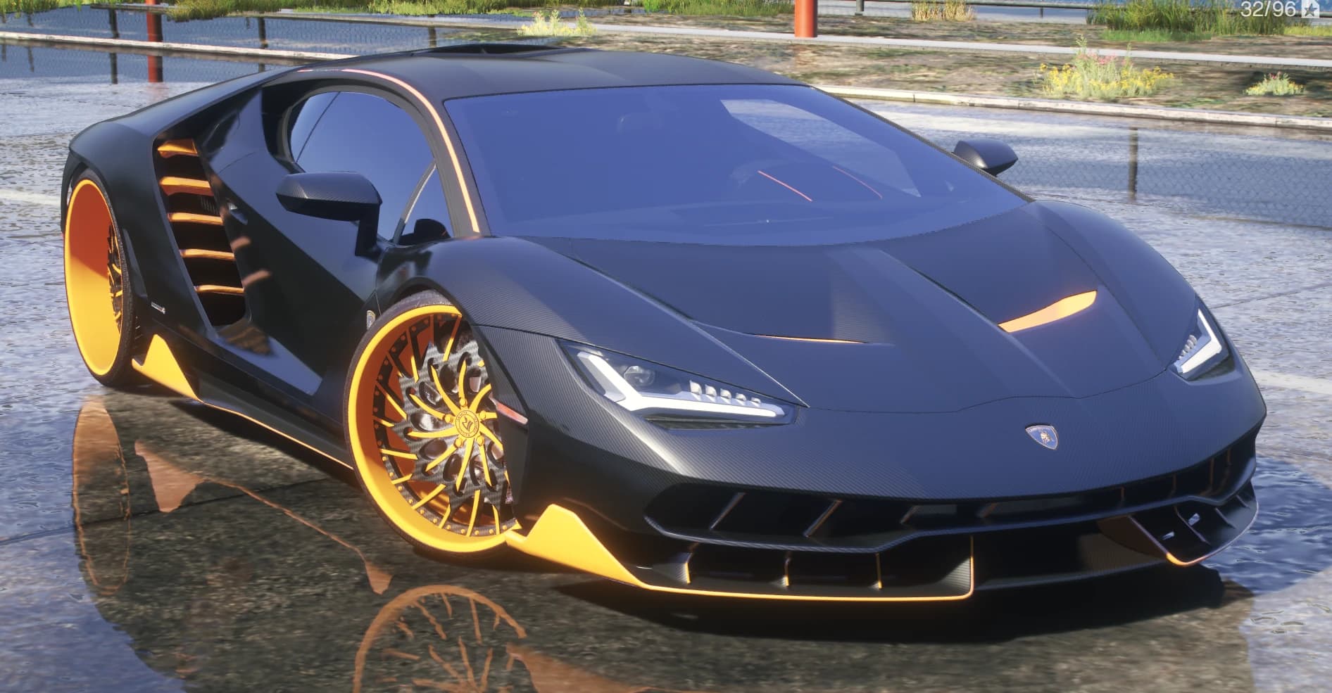 Front three quarter view of the carbon Centenario on wet ground with orange louvres in the side intakes, orange edged splitter and intricate Rucci wheels with orange lips