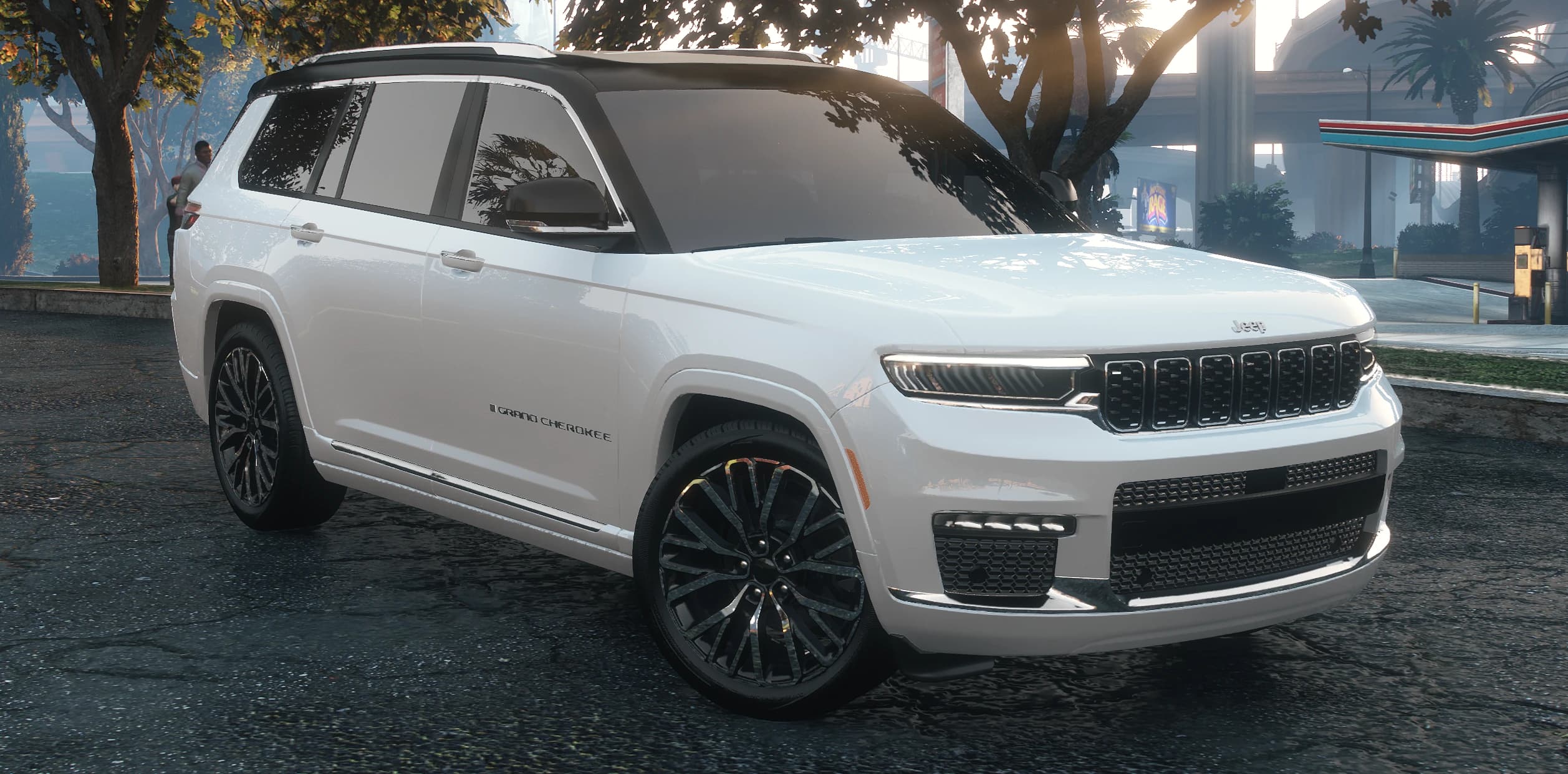 Front three quarter view of the white 2022 Grand Cherokee with the black roof and chrome seven slot grille