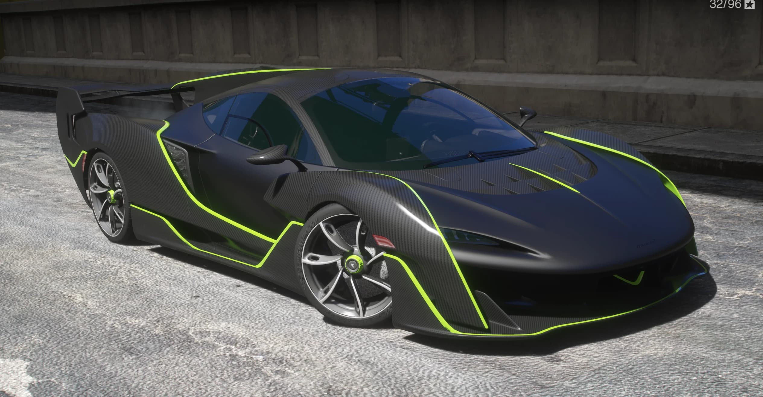 Front three quarter view of the Sabre in exposed carbon fiber with lime green pinstripes
