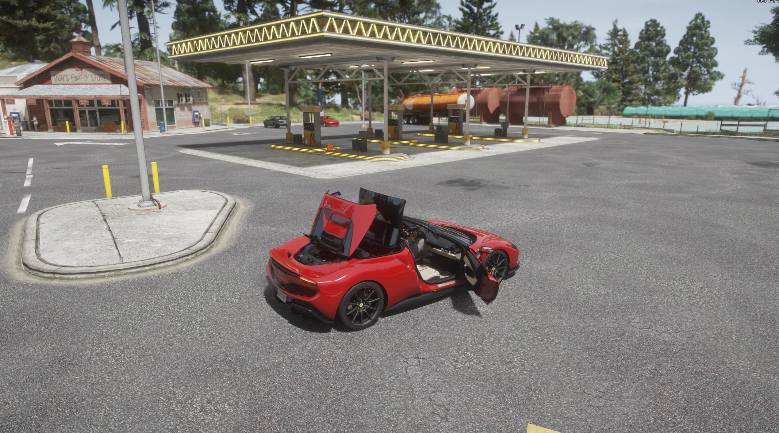 High-angle view of the red 296 GTS with a door and the front boot open at a gas station