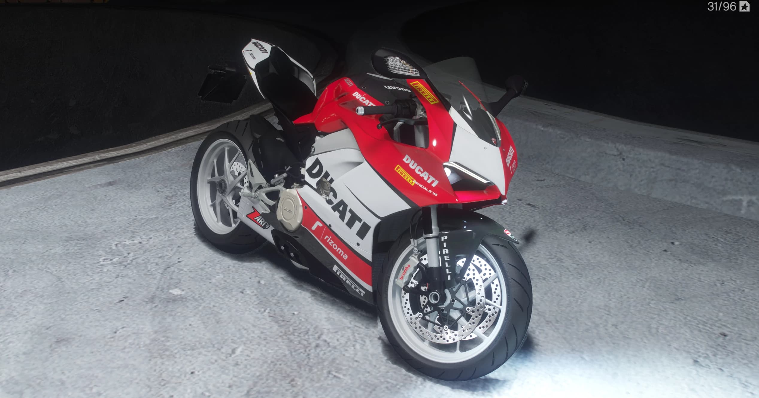 Front three quarter view of the Panigale V4 in a red and white sponsor livery with white wheels, Brembo calipers and a Pirelli fork guard