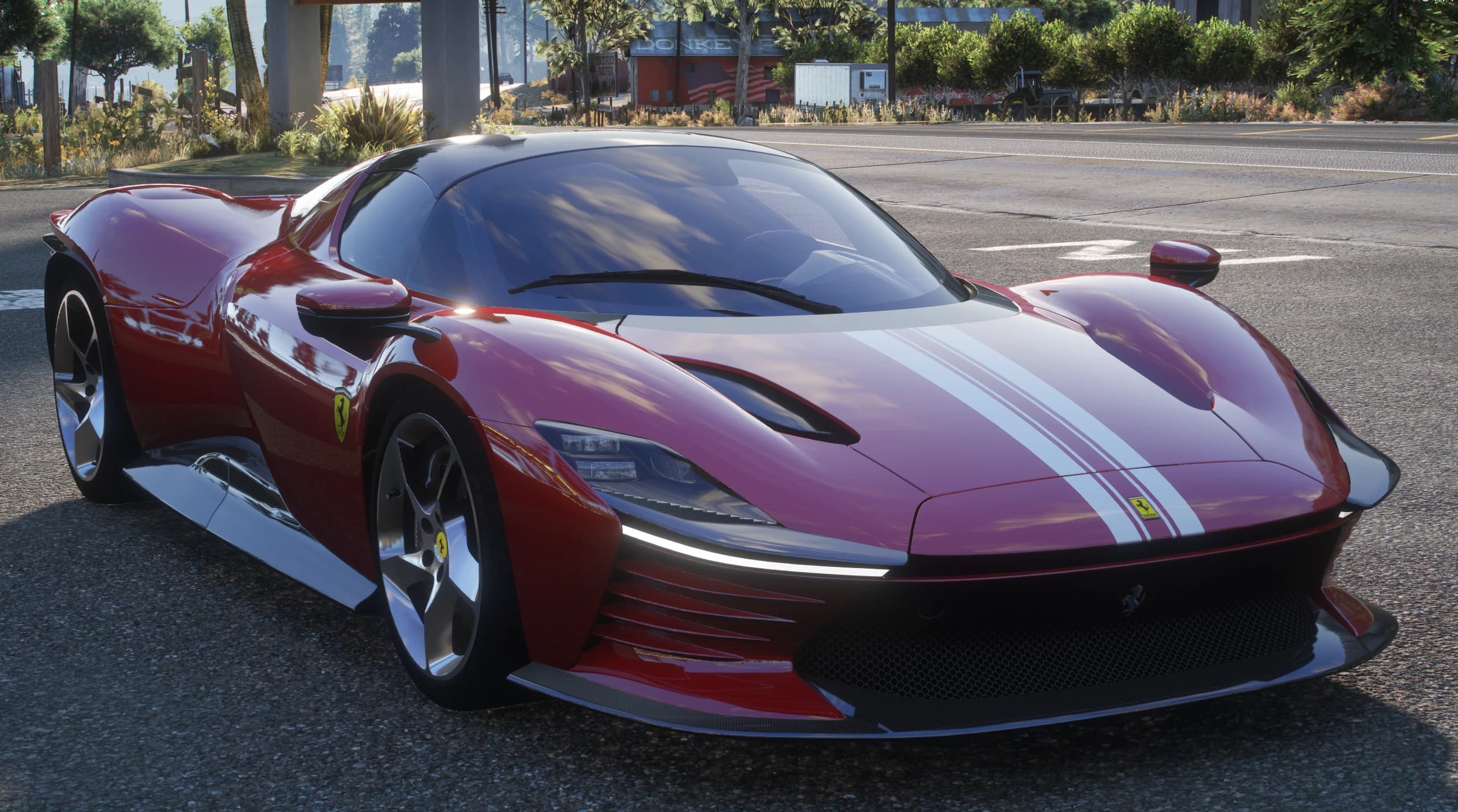 Front view of the Daytona SP3 with the black roof closed, white stripes and slim LED light strip, next to a barn painted with a US flag