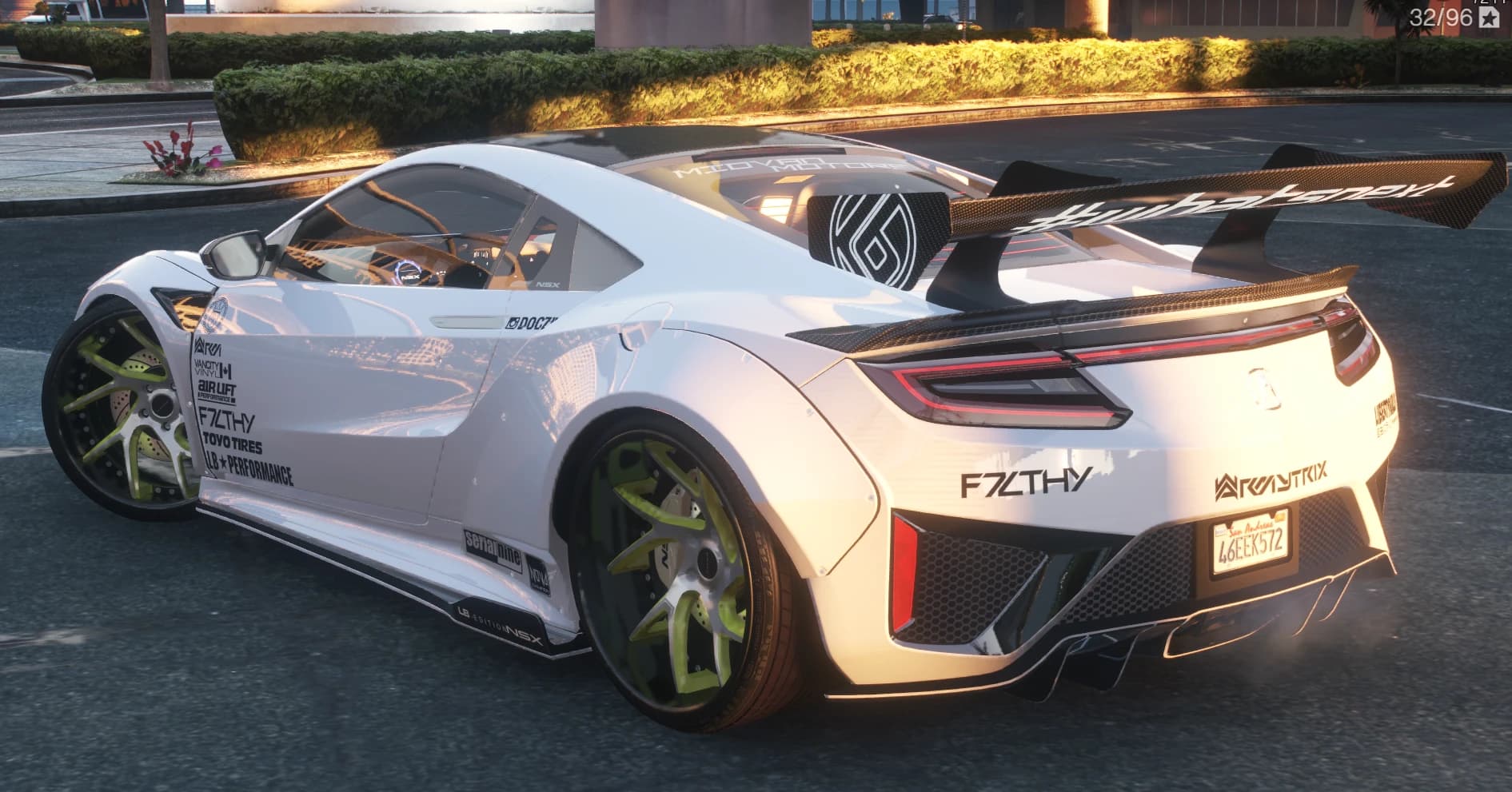 Rear three quarter view with the carbon whatsnext wing, F7LTHY and Armytrix decals, red bumper vents and heavy wheel camber