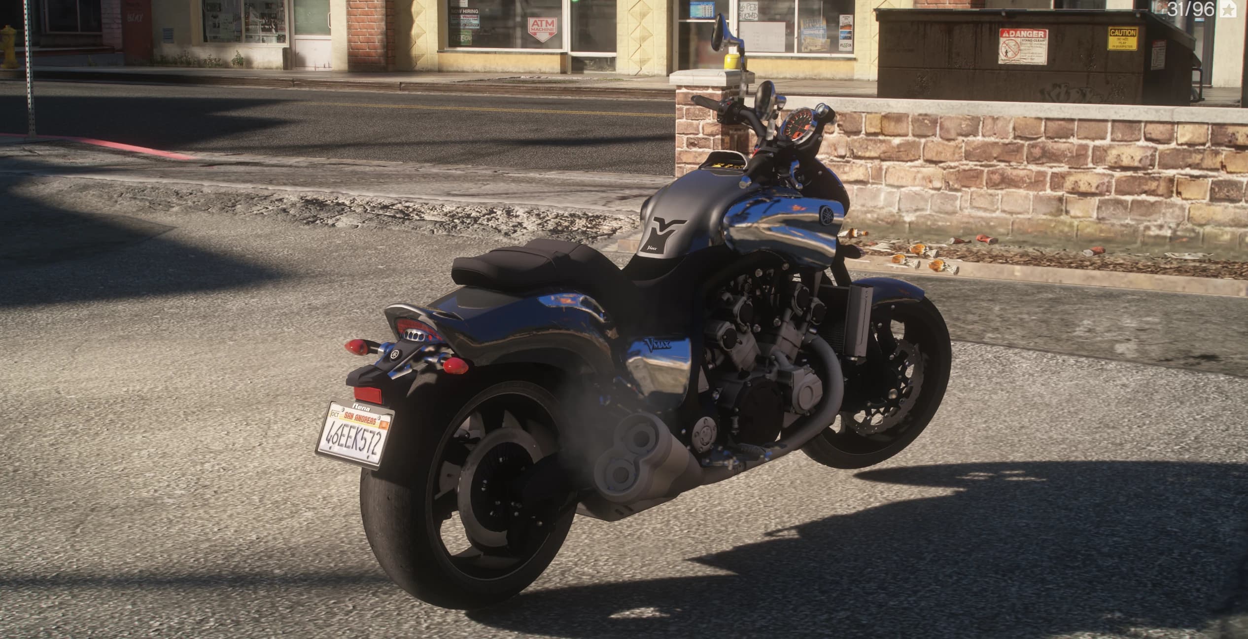Rear three quarter view showing the V-MAX badge on the flank, stacked chrome mufflers, fat rear tyre and a San Andreas plate