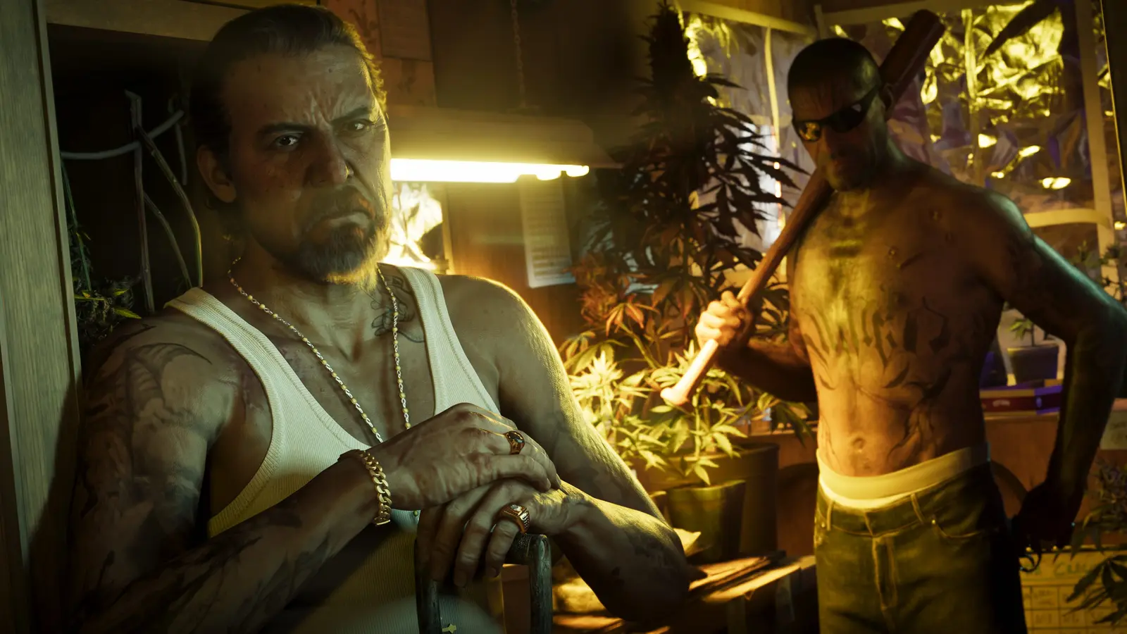 Two men inside a cannabis grow room lit by yellow lamps, one leaning on a chair and the other holding a baseball bat over his shoulder