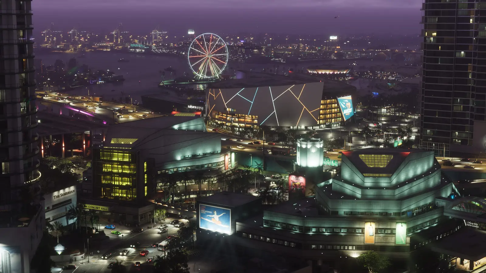 Downtown Vice City at night from above, with the Sahara Arena lit up, a Ferris wheel on the waterfront and traffic moving along the elevated highway